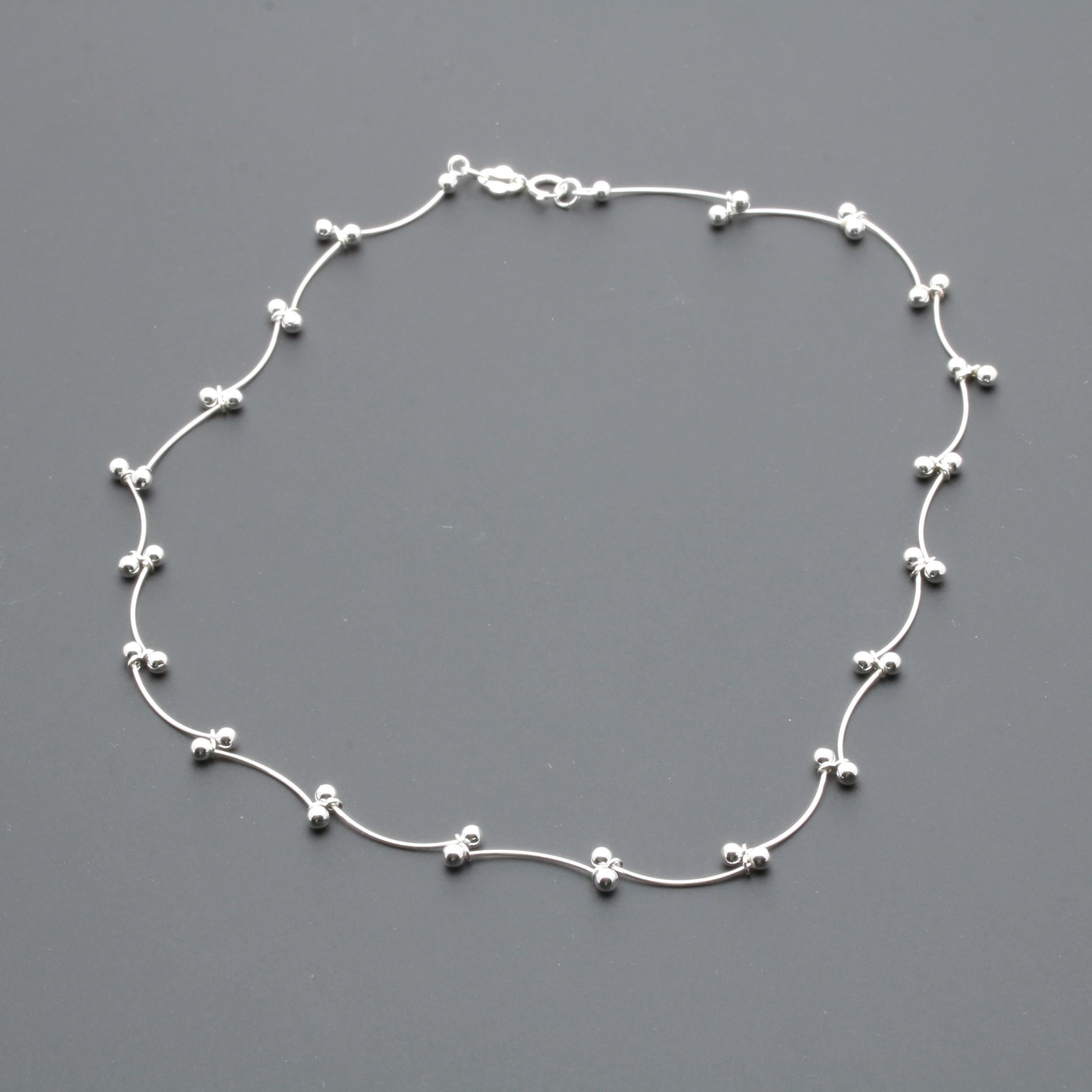 Sterling Silver Necklace and Earring Assortment Featuring Amber