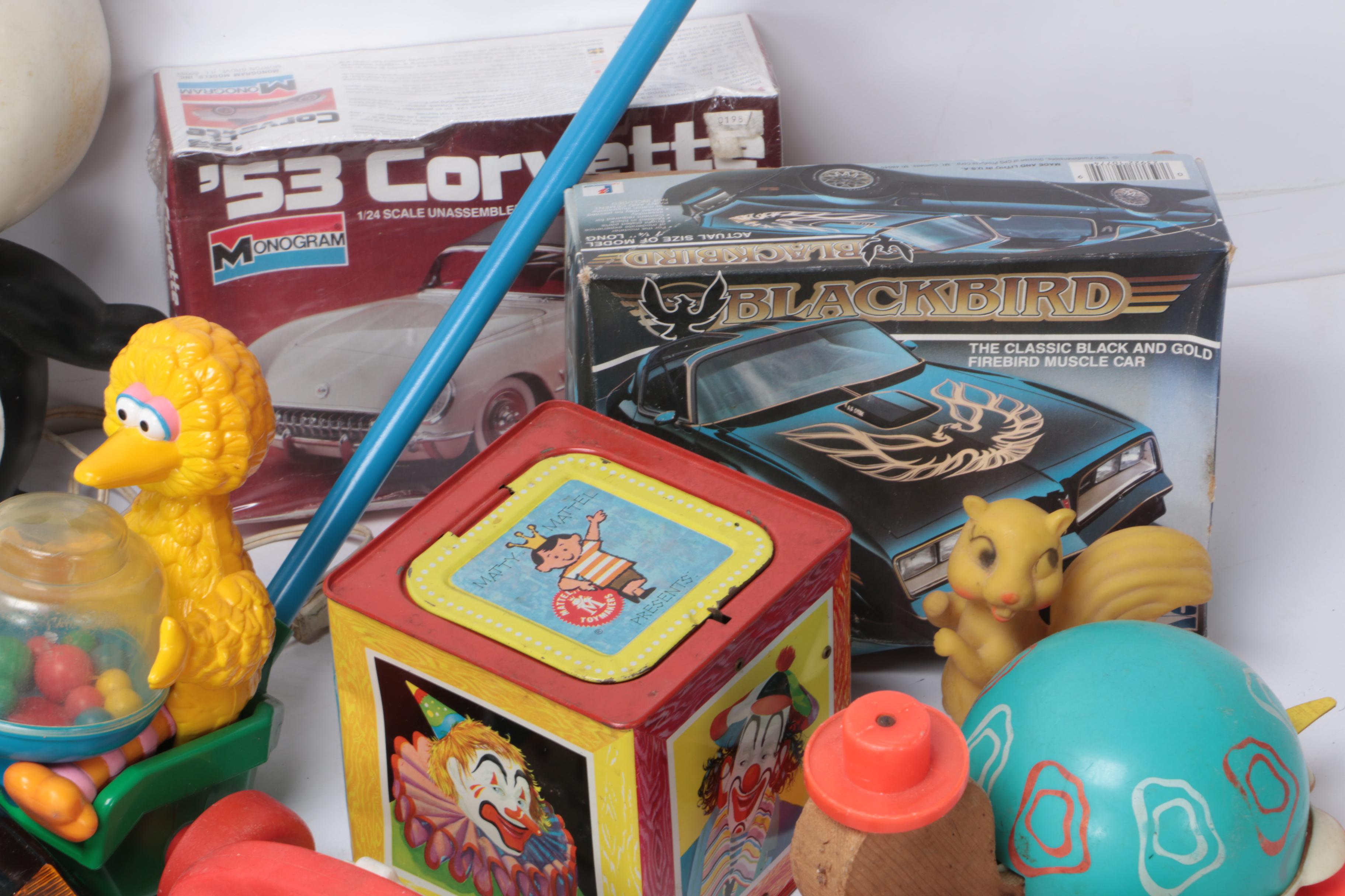Vintage Toy Collection Including Model Kits, Fisher Price Phone, and More