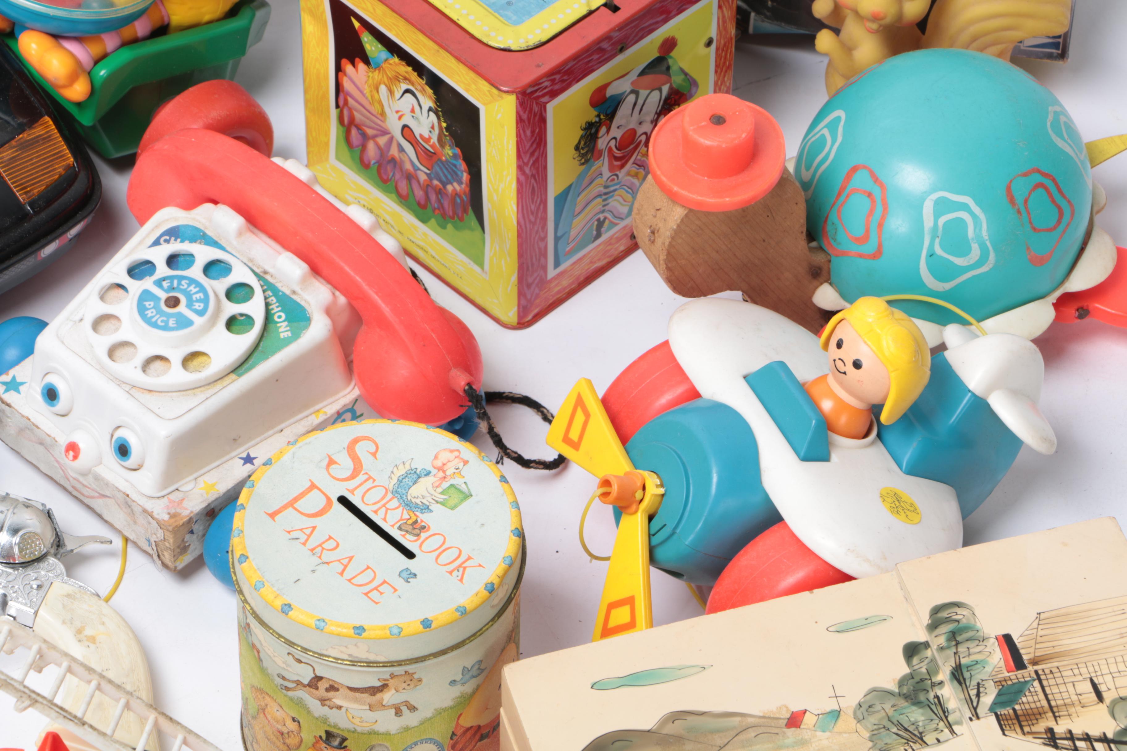 Vintage Toy Collection Including Model Kits, Fisher Price Phone, and More