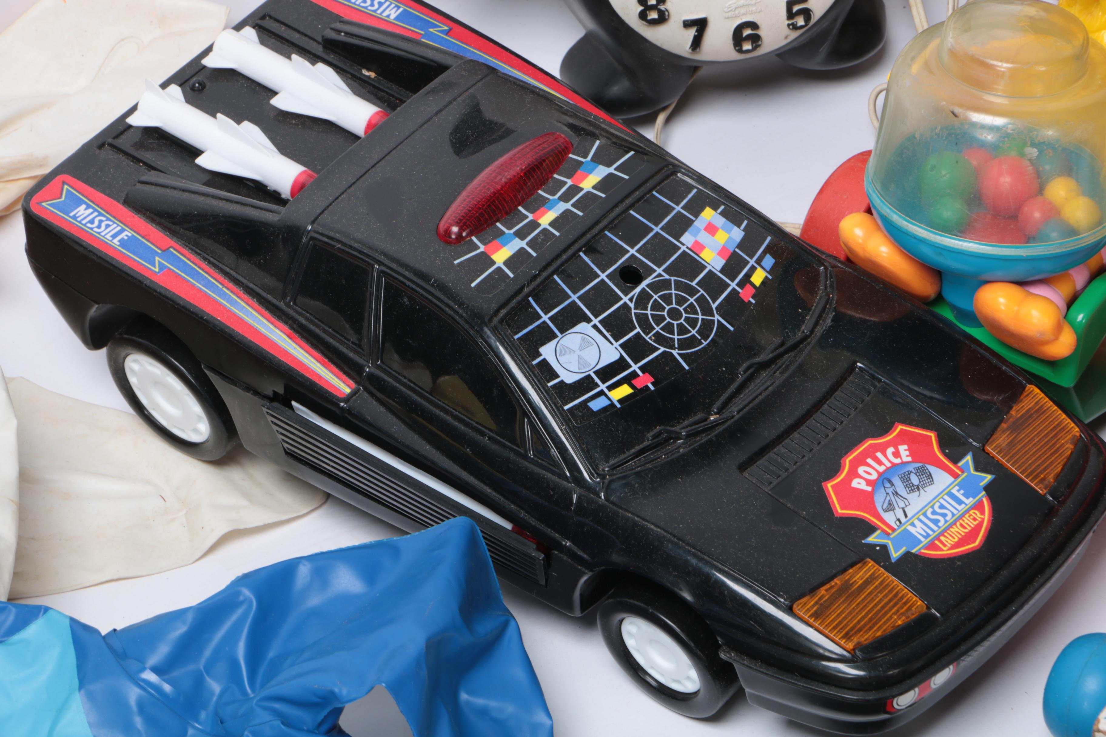 Vintage Toy Collection Including Model Kits, Fisher Price Phone, and More