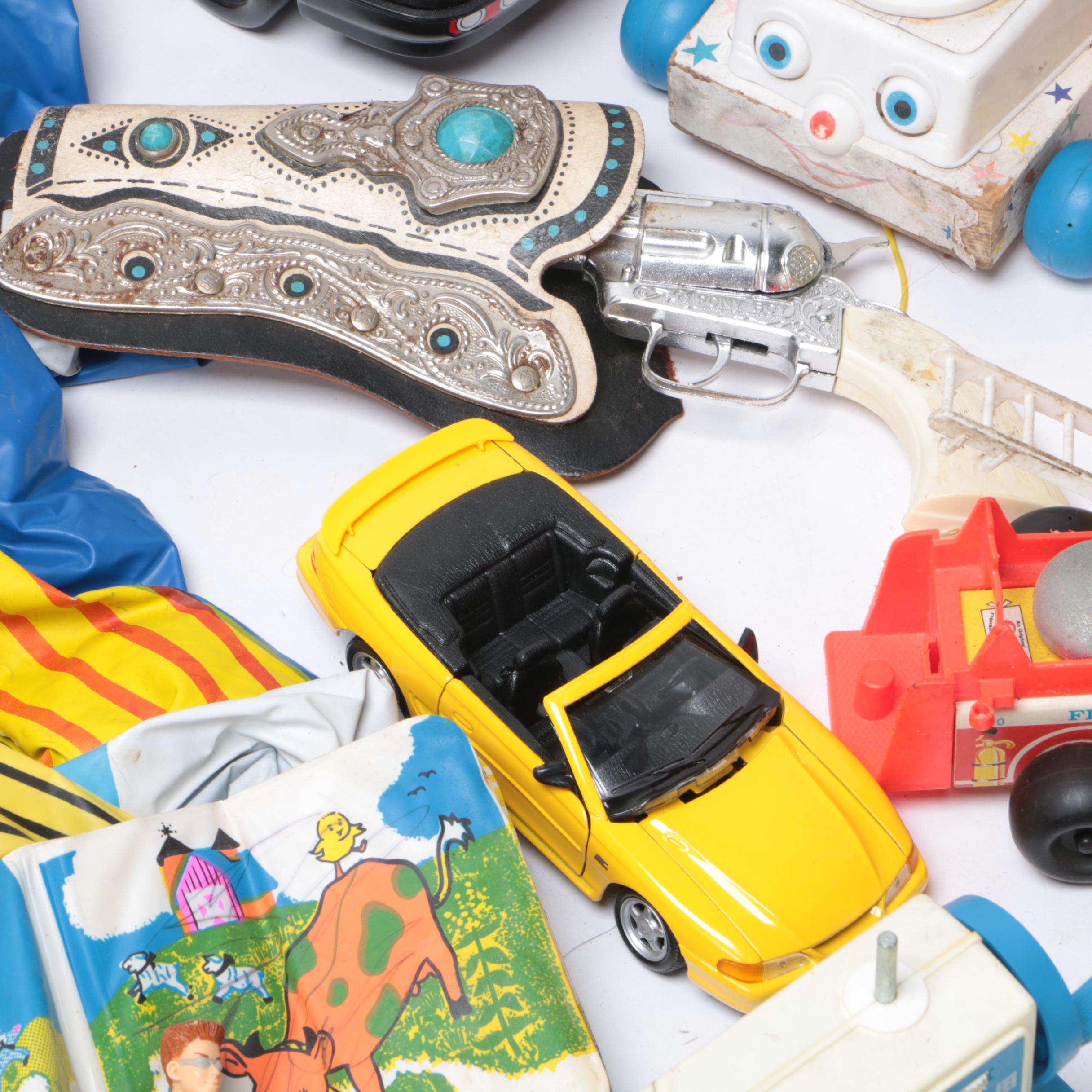 Vintage Toy Collection Including Model Kits, Fisher Price Phone, and More