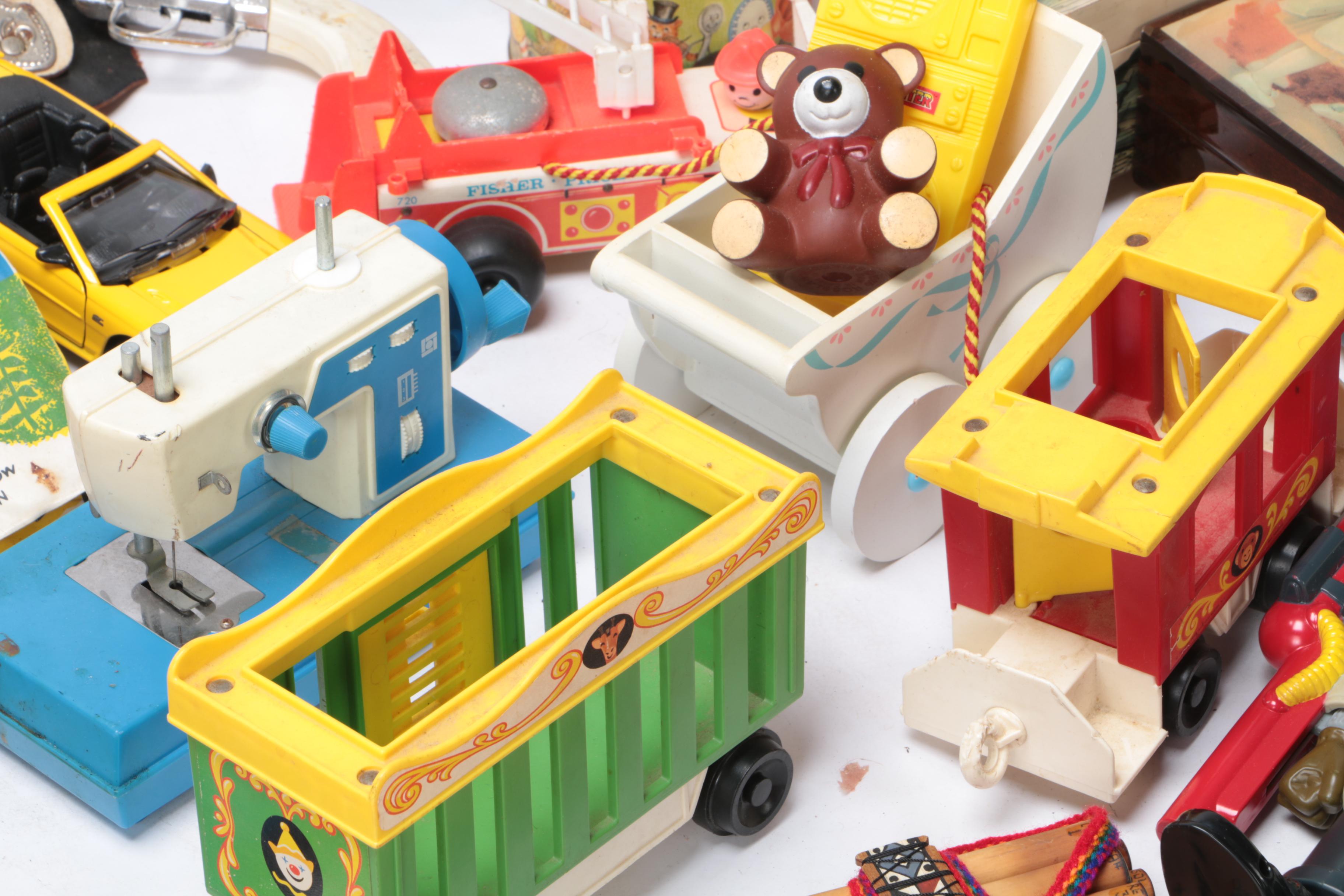 Vintage Toy Collection Including Model Kits, Fisher Price Phone, and More
