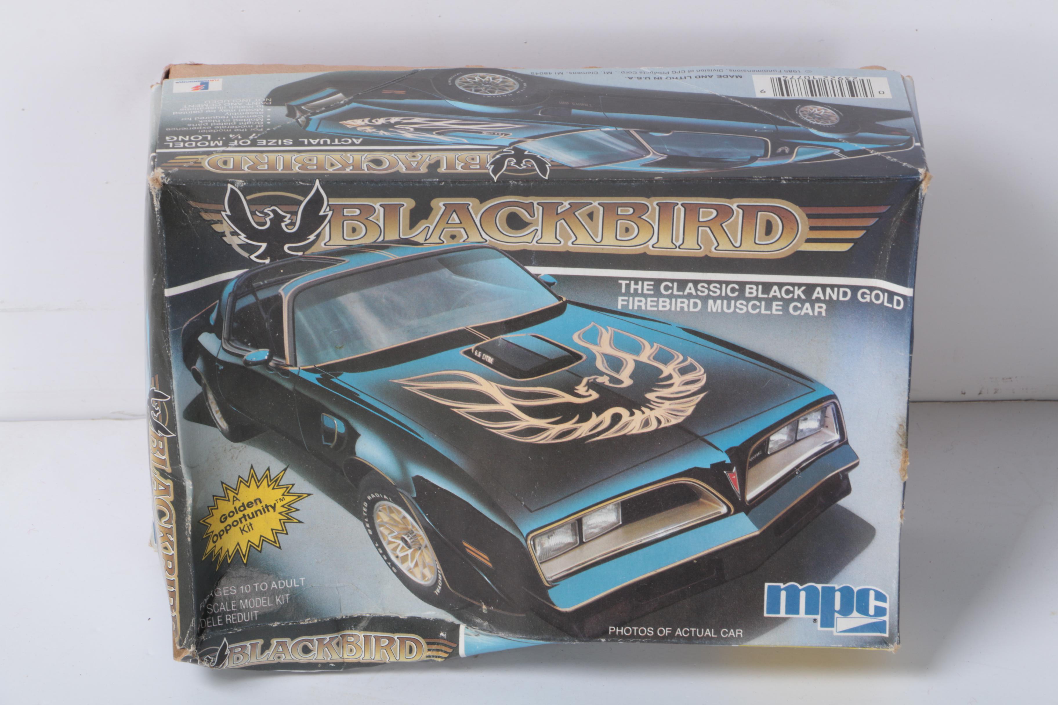 Vintage Toy Collection Including Model Kits, Fisher Price Phone, and More