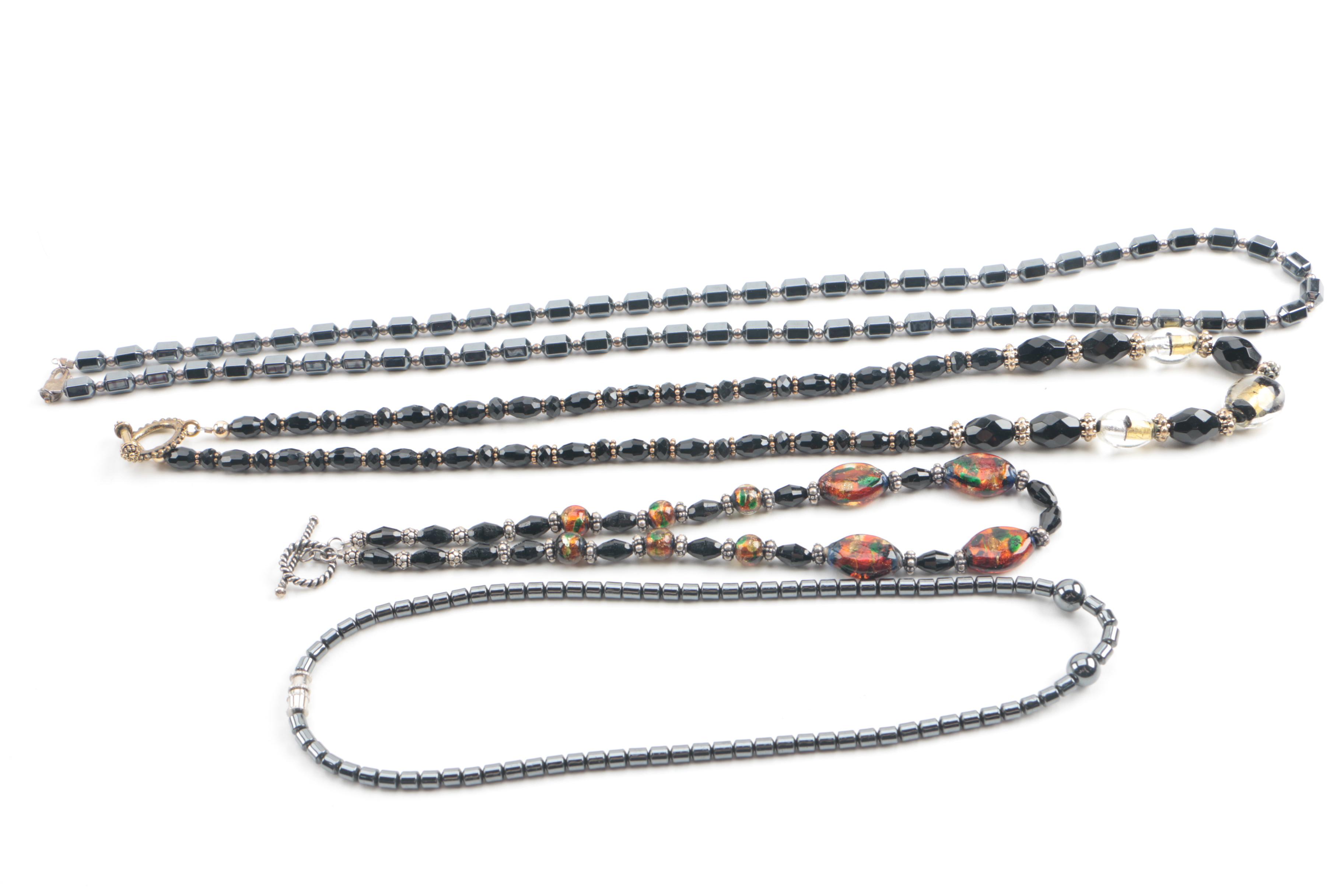 Assortment of Jewelry Featuring Glass, Carnelian, and Hematite