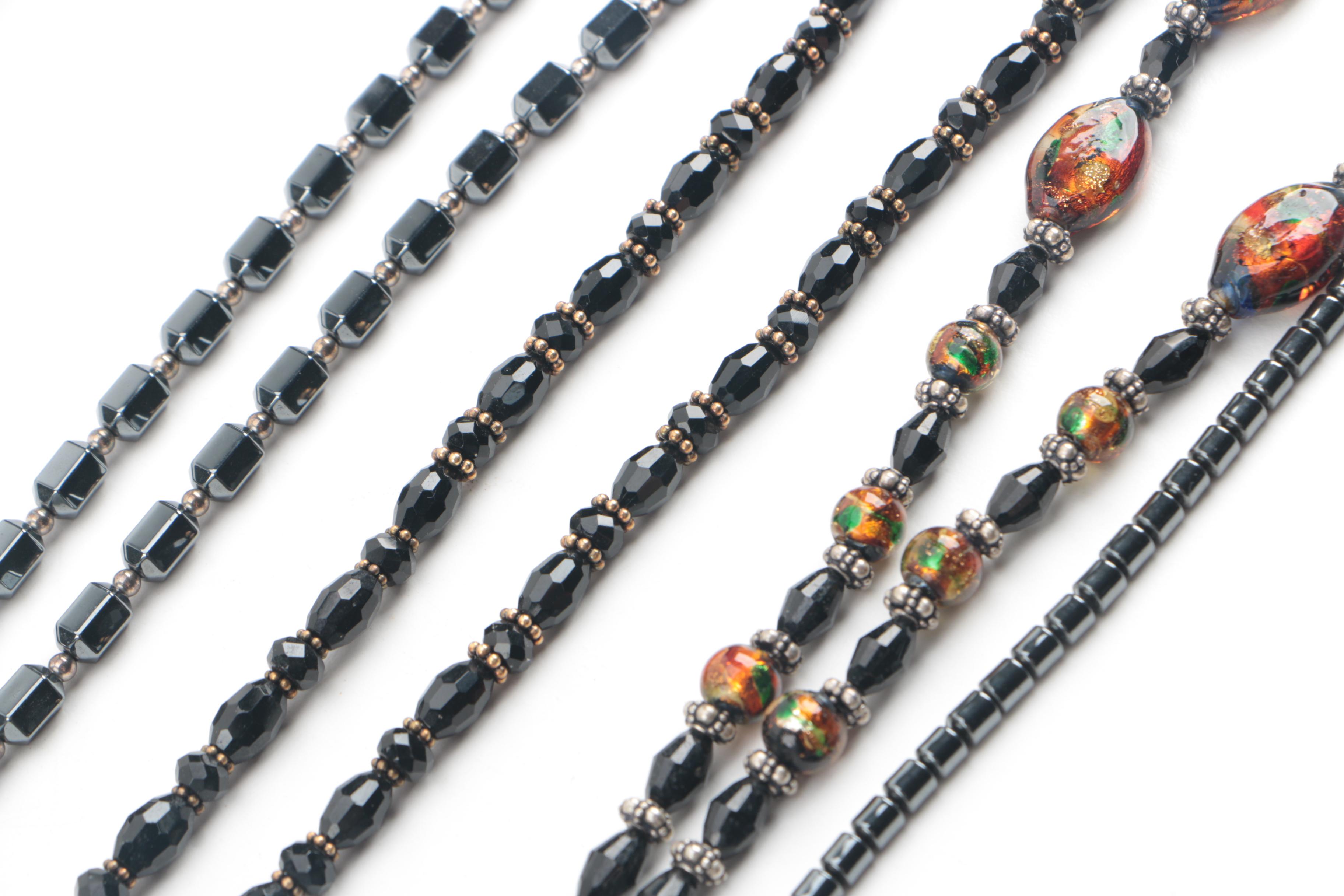 Assortment of Jewelry Featuring Glass, Carnelian, and Hematite