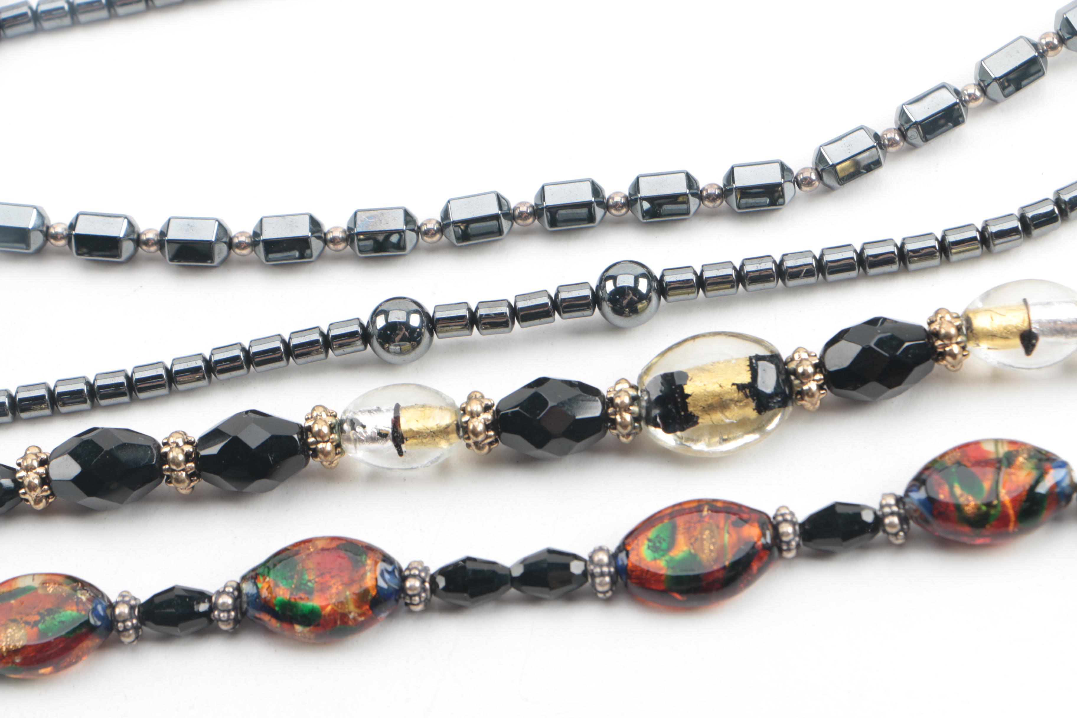 Assortment of Jewelry Featuring Glass, Carnelian, and Hematite