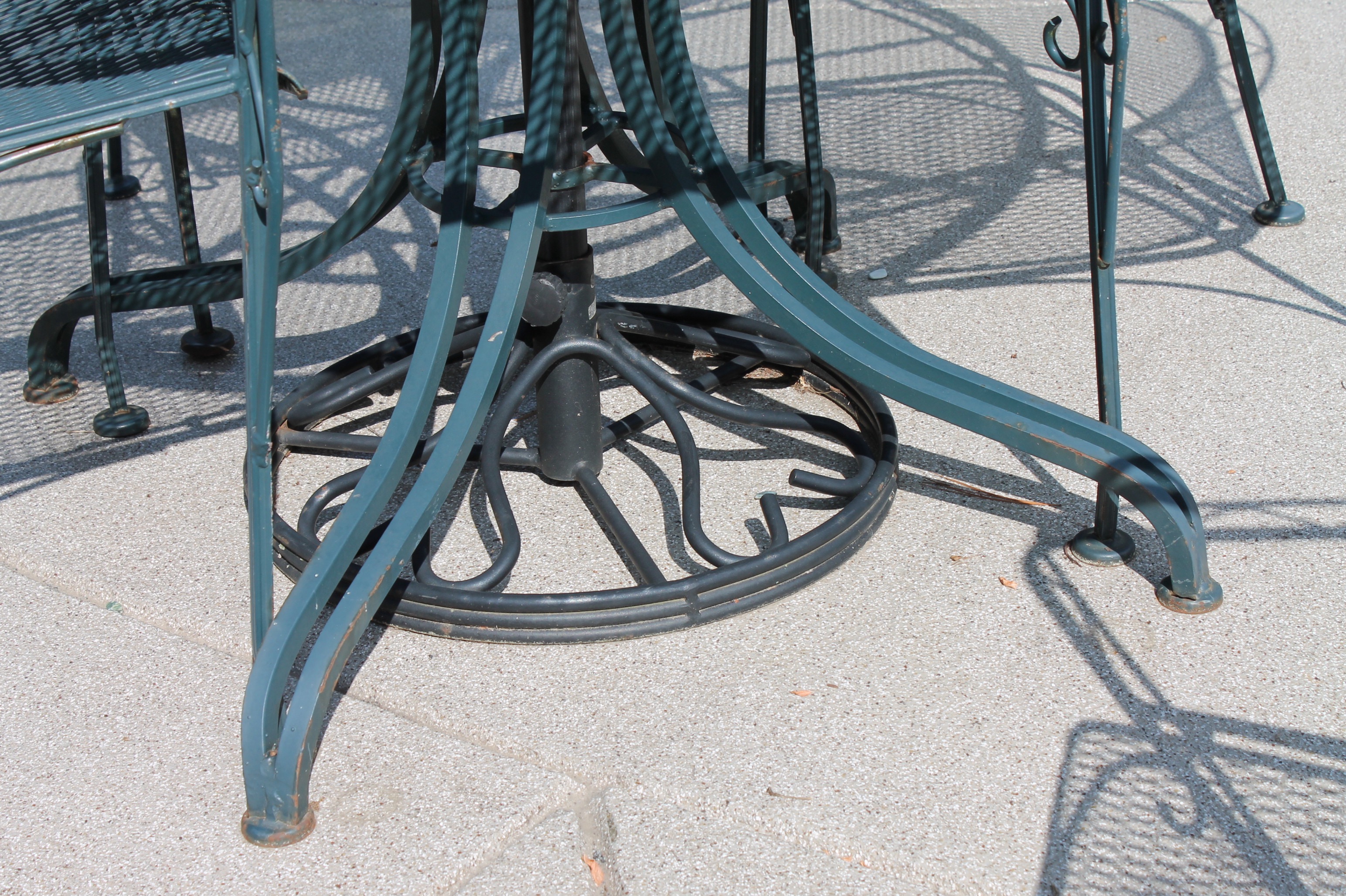 Bent Metal Patio Table and Chairs with Umbrella