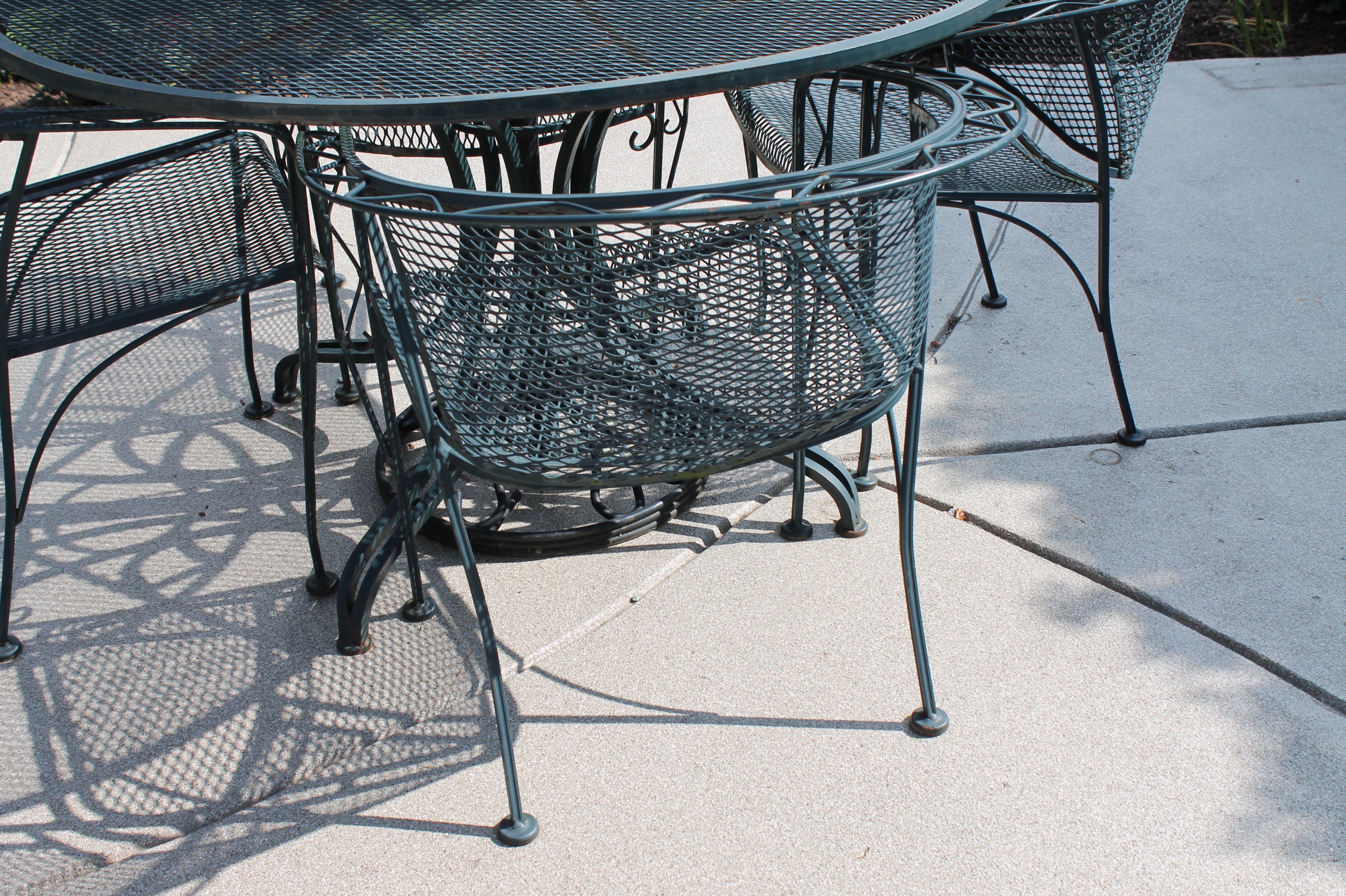 Bent Metal Patio Table and Chairs with Umbrella