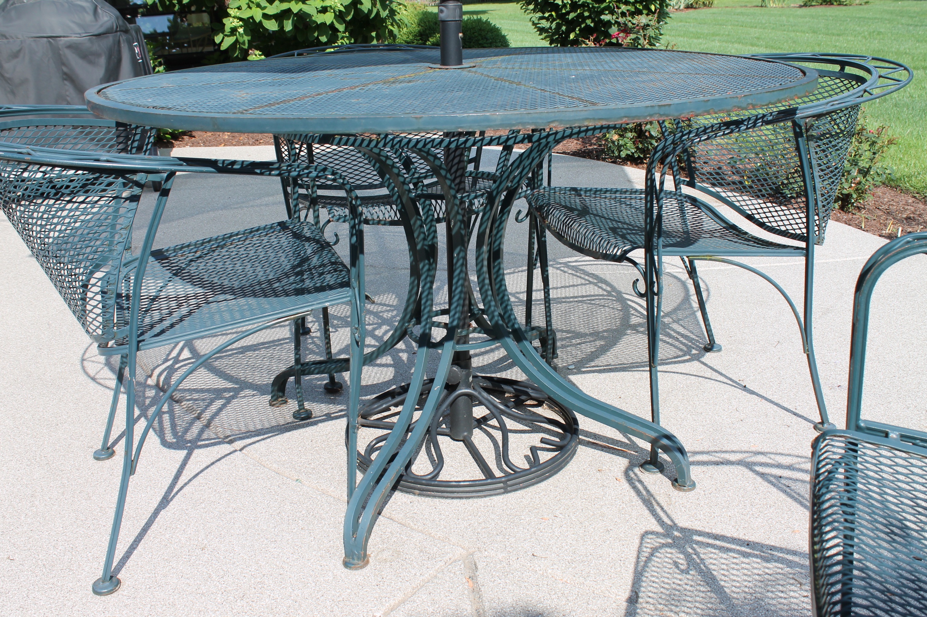 Bent Metal Patio Table and Chairs with Umbrella
