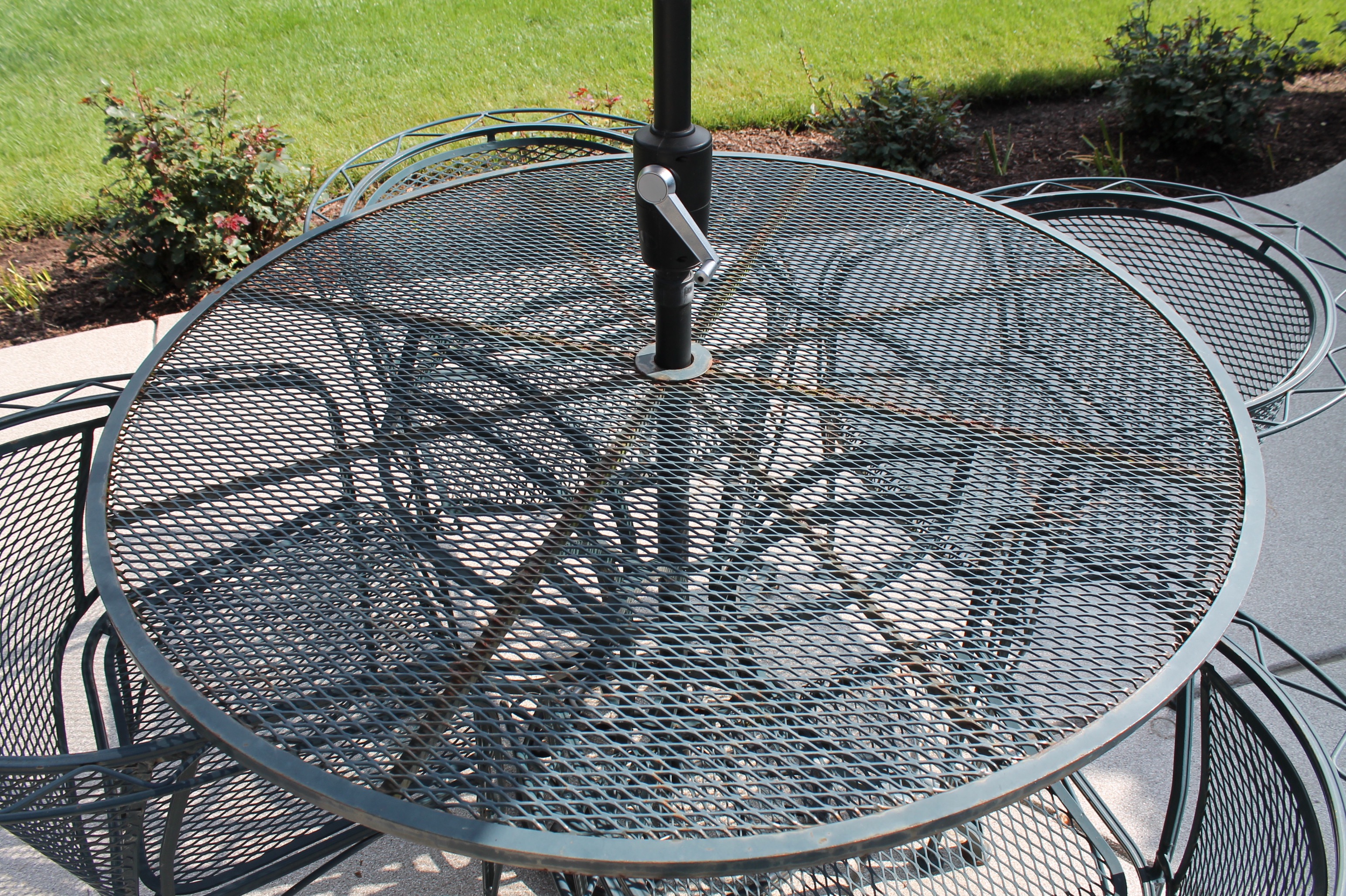 Bent Metal Patio Table and Chairs with Umbrella