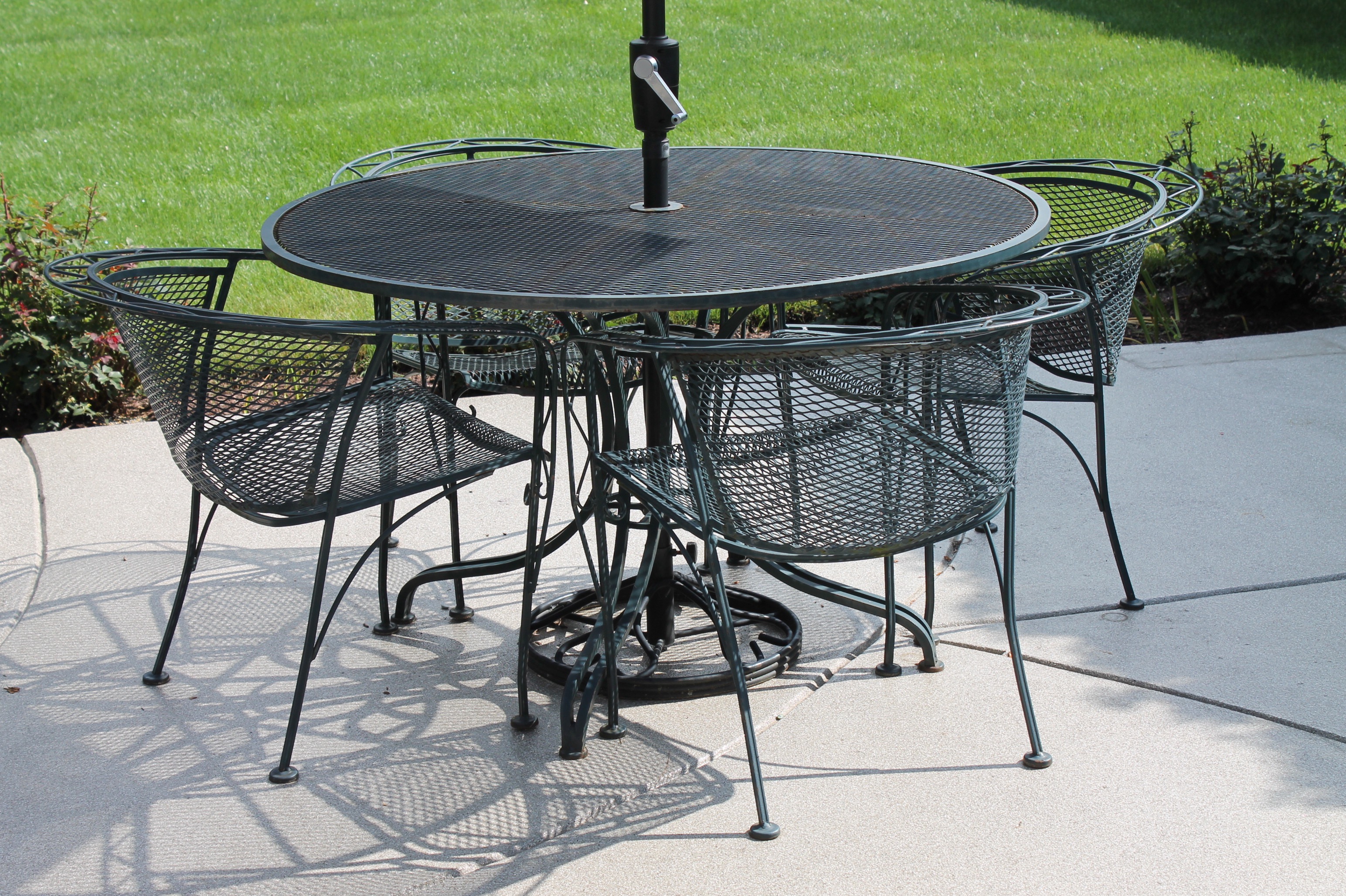Bent Metal Patio Table and Chairs with Umbrella