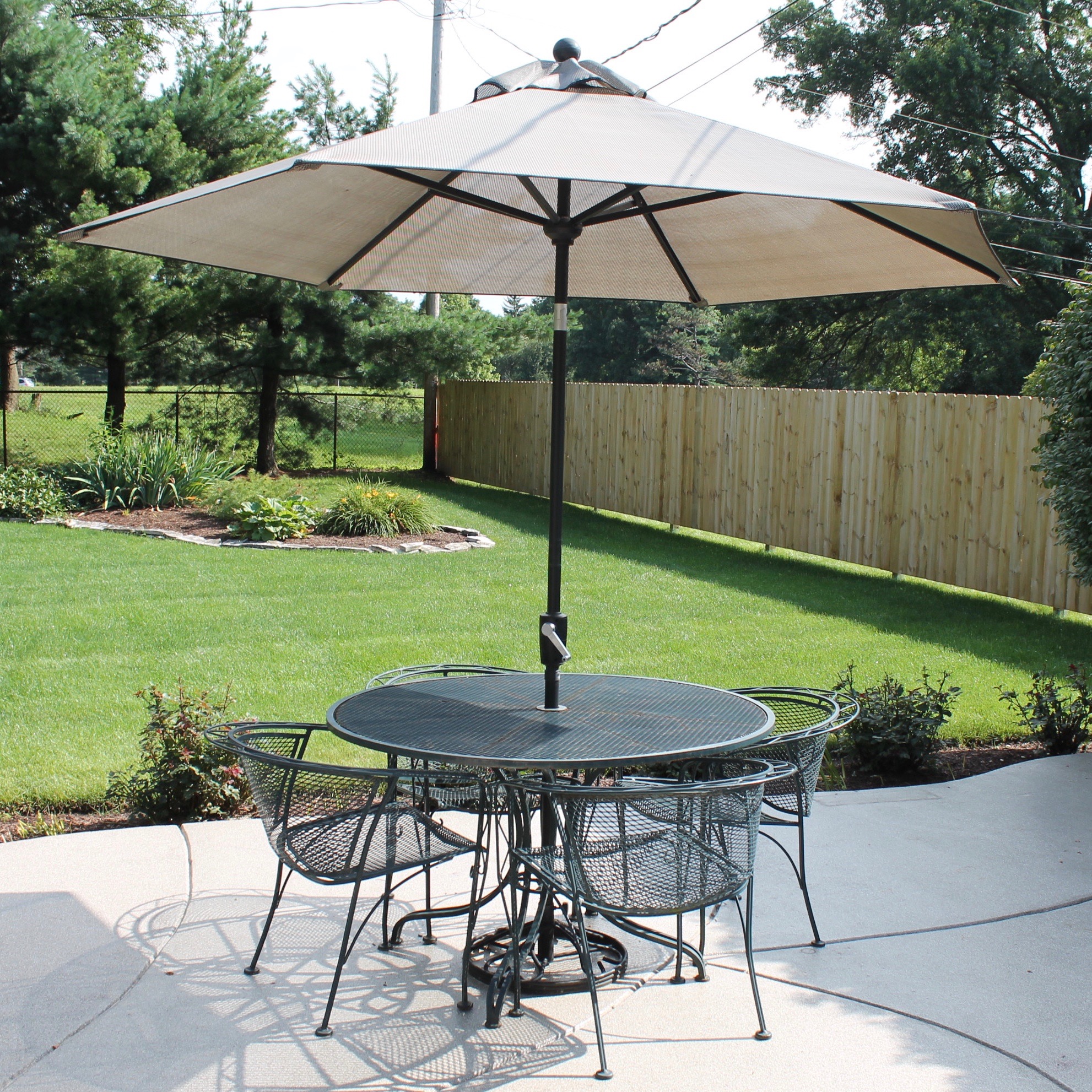 Bent Metal Patio Table and Chairs with Umbrella