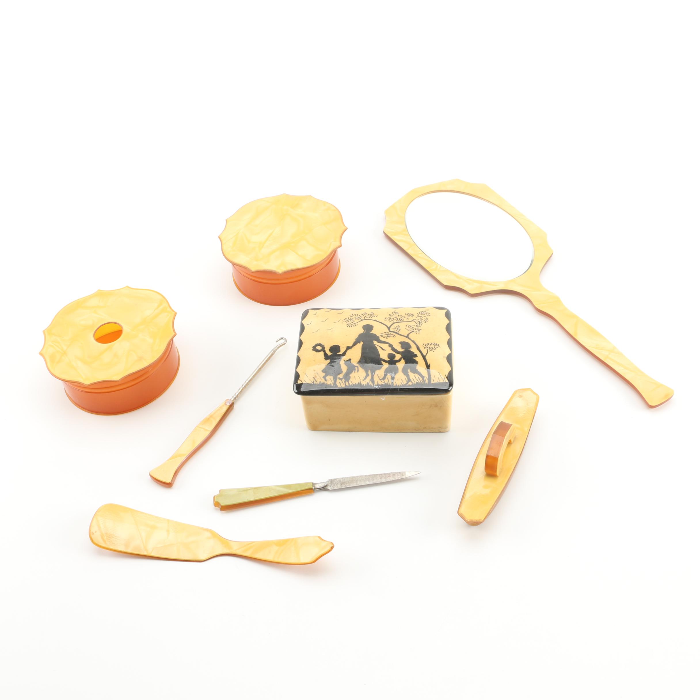 Vintage Seven-Piece Celluloid Vanity Set and Erphila Art Pottery Lidded Box