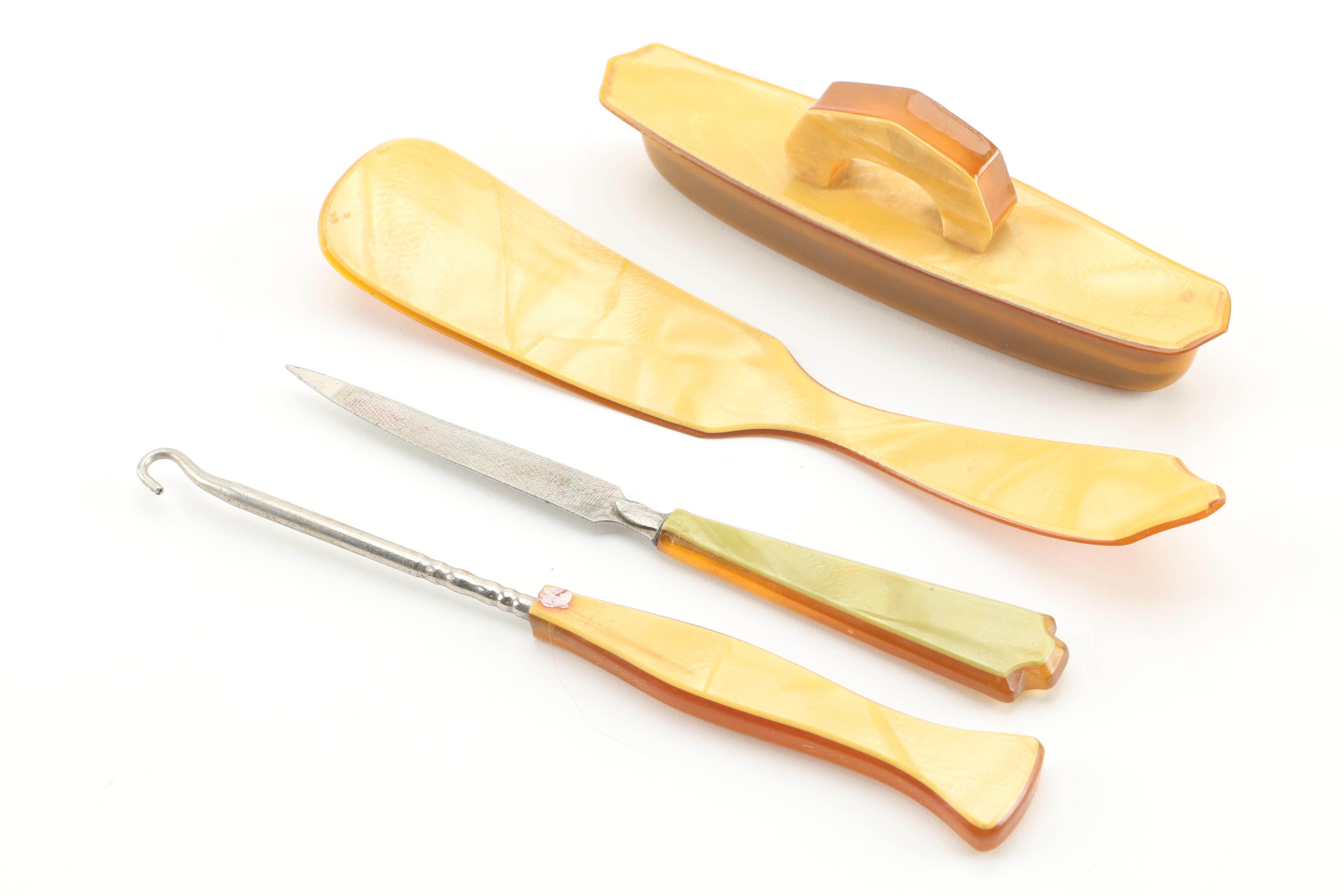 Vintage Seven-Piece Celluloid Vanity Set and Erphila Art Pottery Lidded Box