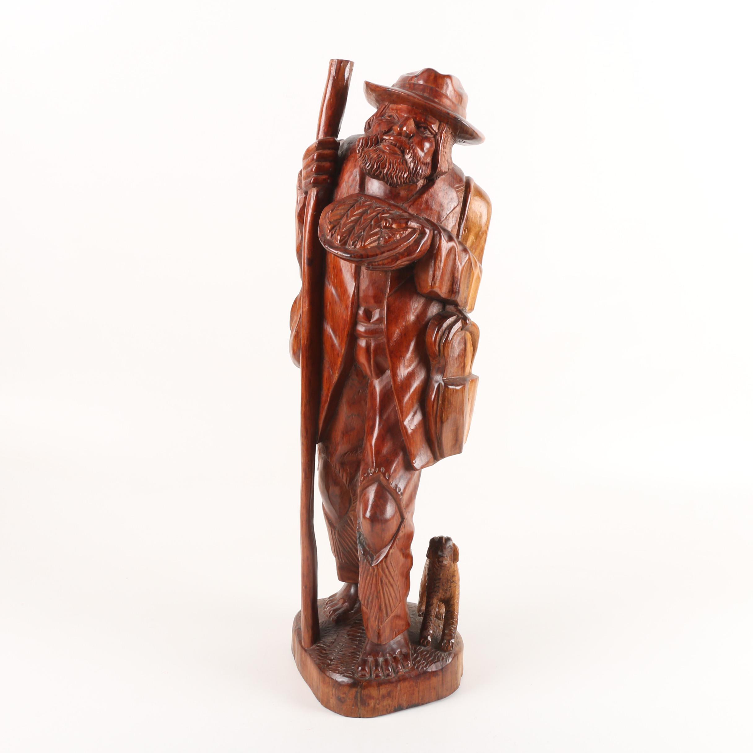 Carved Wood Sculpture of Mountain Man Walking with Dog