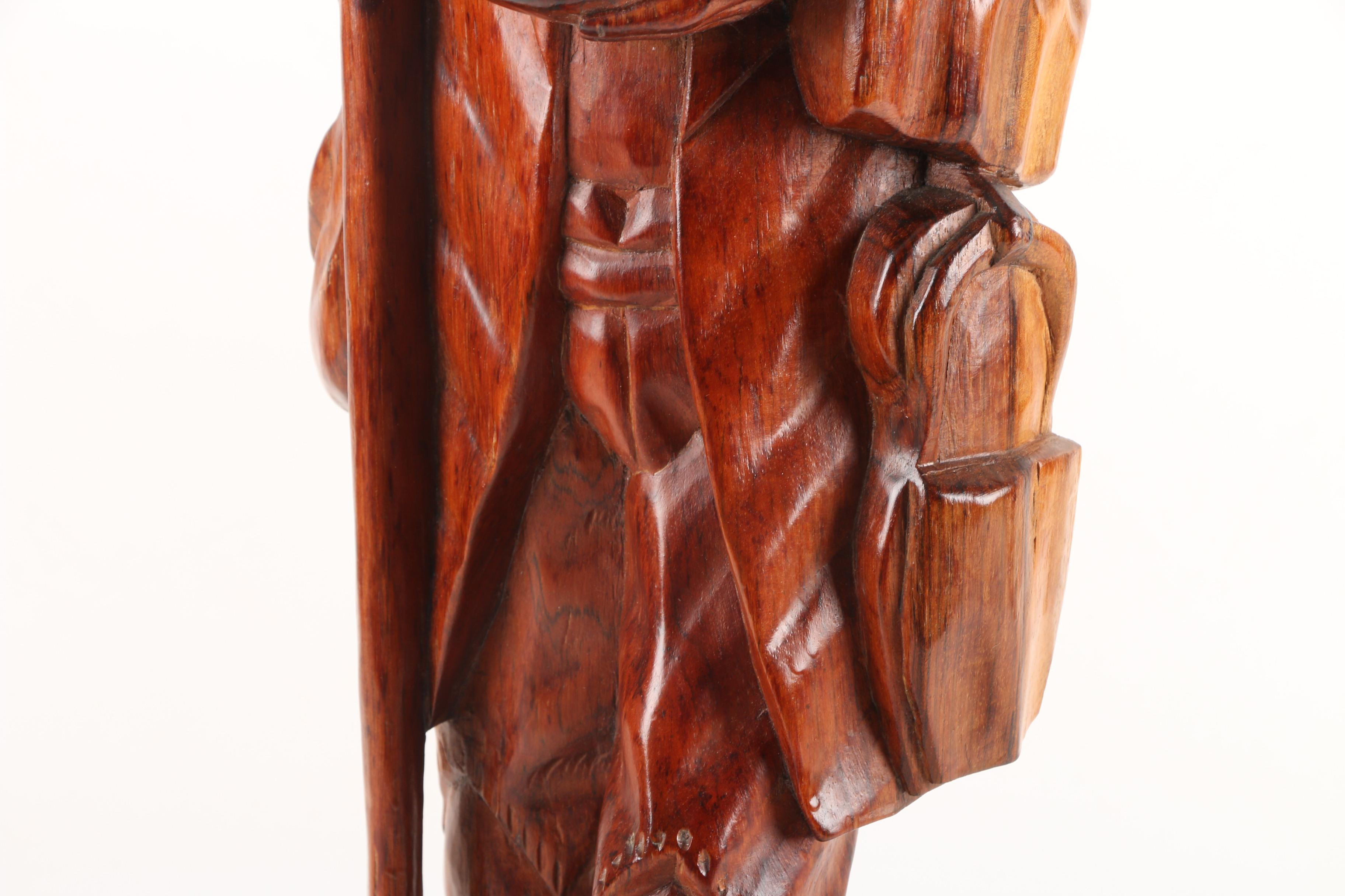 Carved Wood Sculpture of Mountain Man Walking with Dog