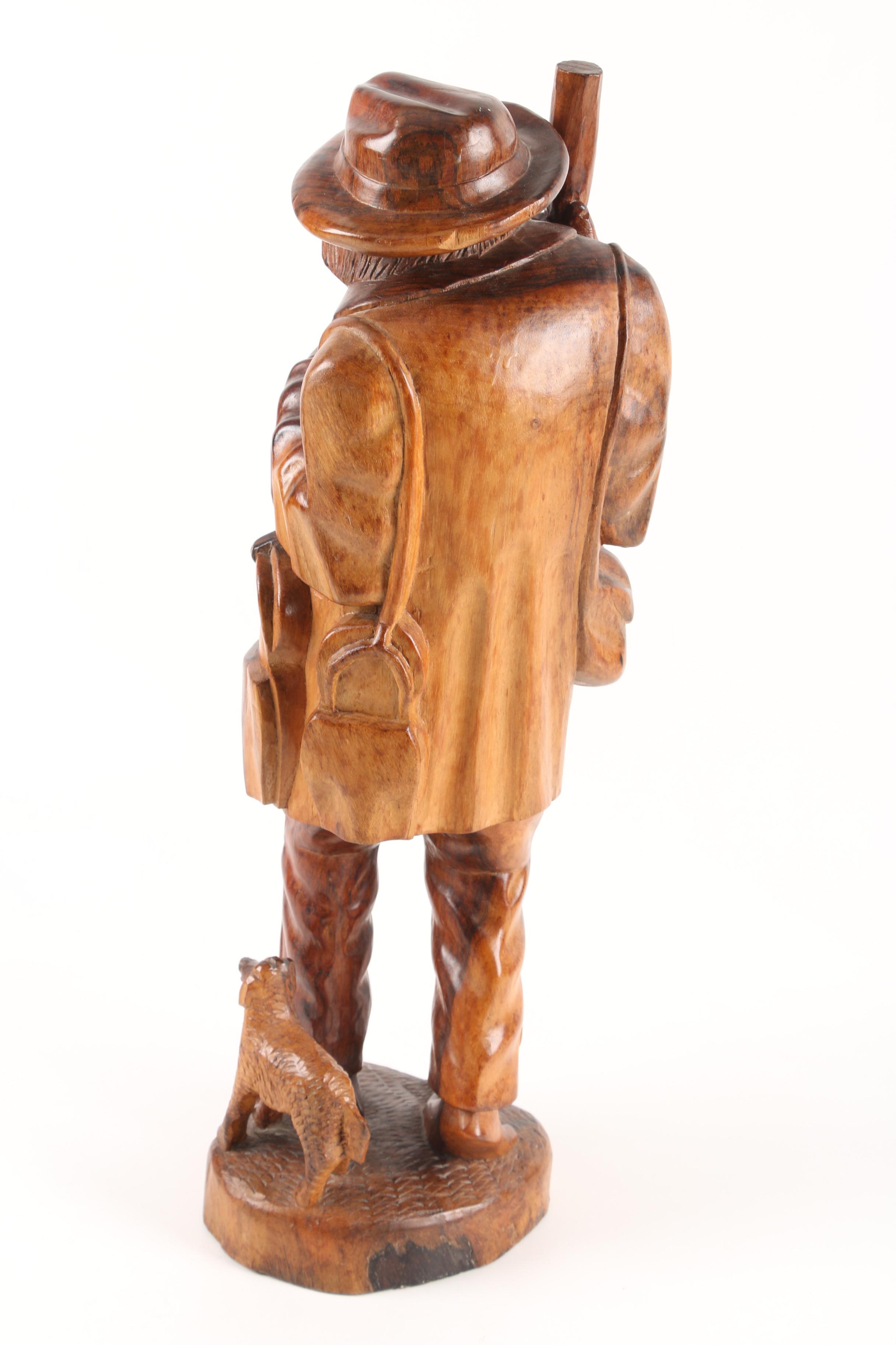 Carved Wood Sculpture of Mountain Man Walking with Dog