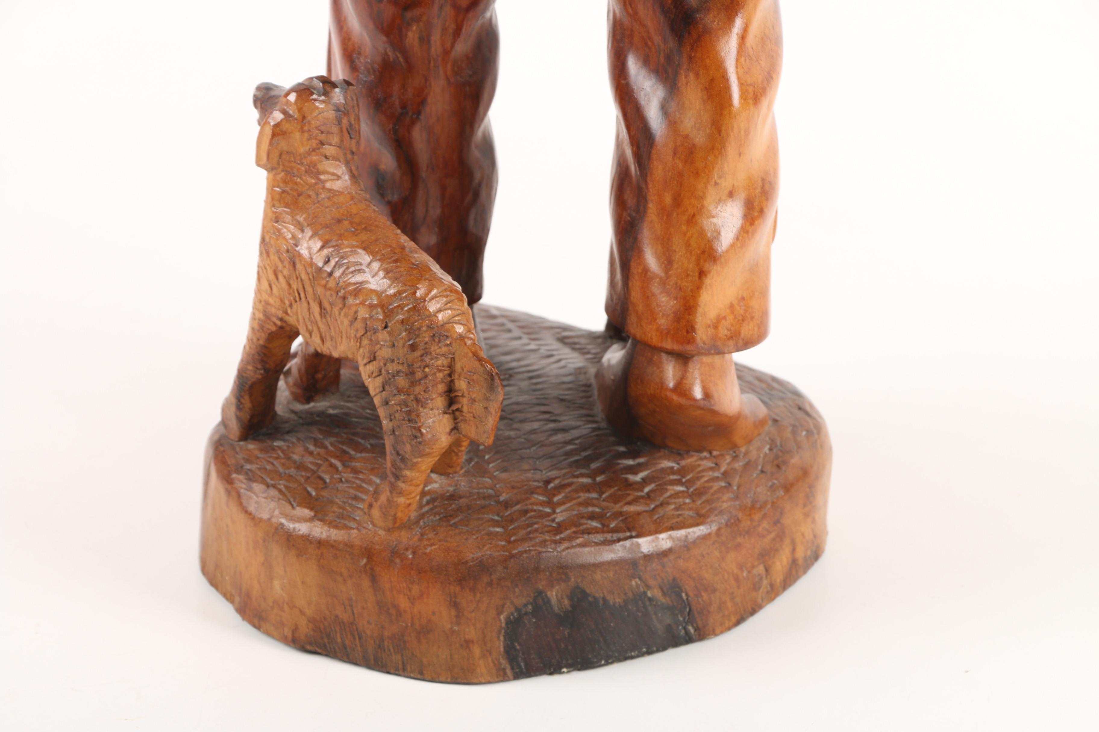 Carved Wood Sculpture of Mountain Man Walking with Dog