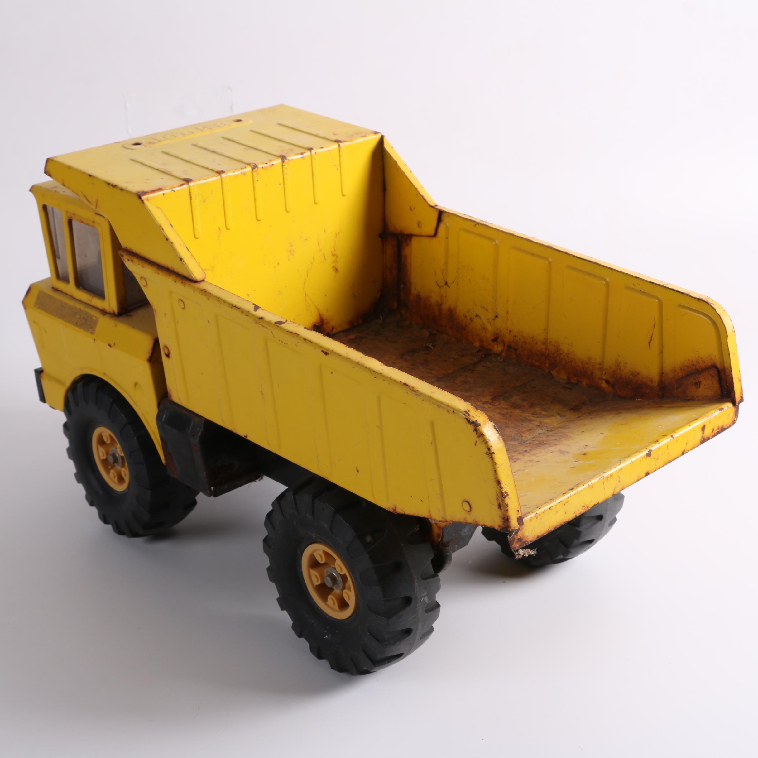 Vintage Tonka Dump Truck, Hubley Trailer, and Cypress Kness