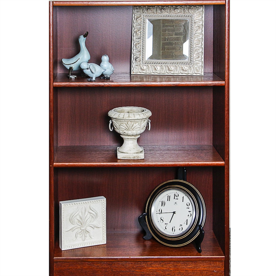 Bookcase with Framed Mirror, Duck Figurines, and More