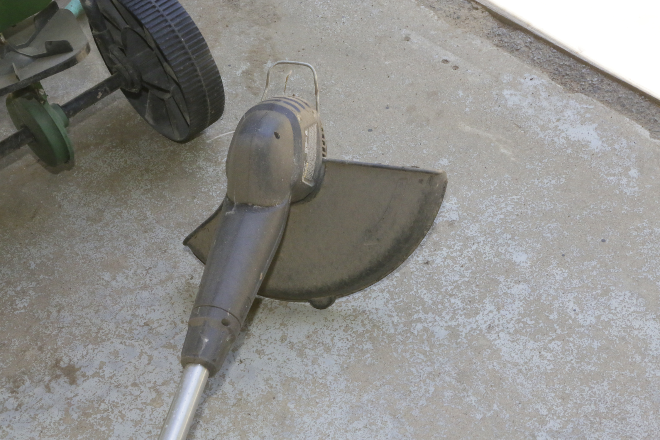 Wheel Barrow, String Trimmer and Scotts Broadcast Spreader