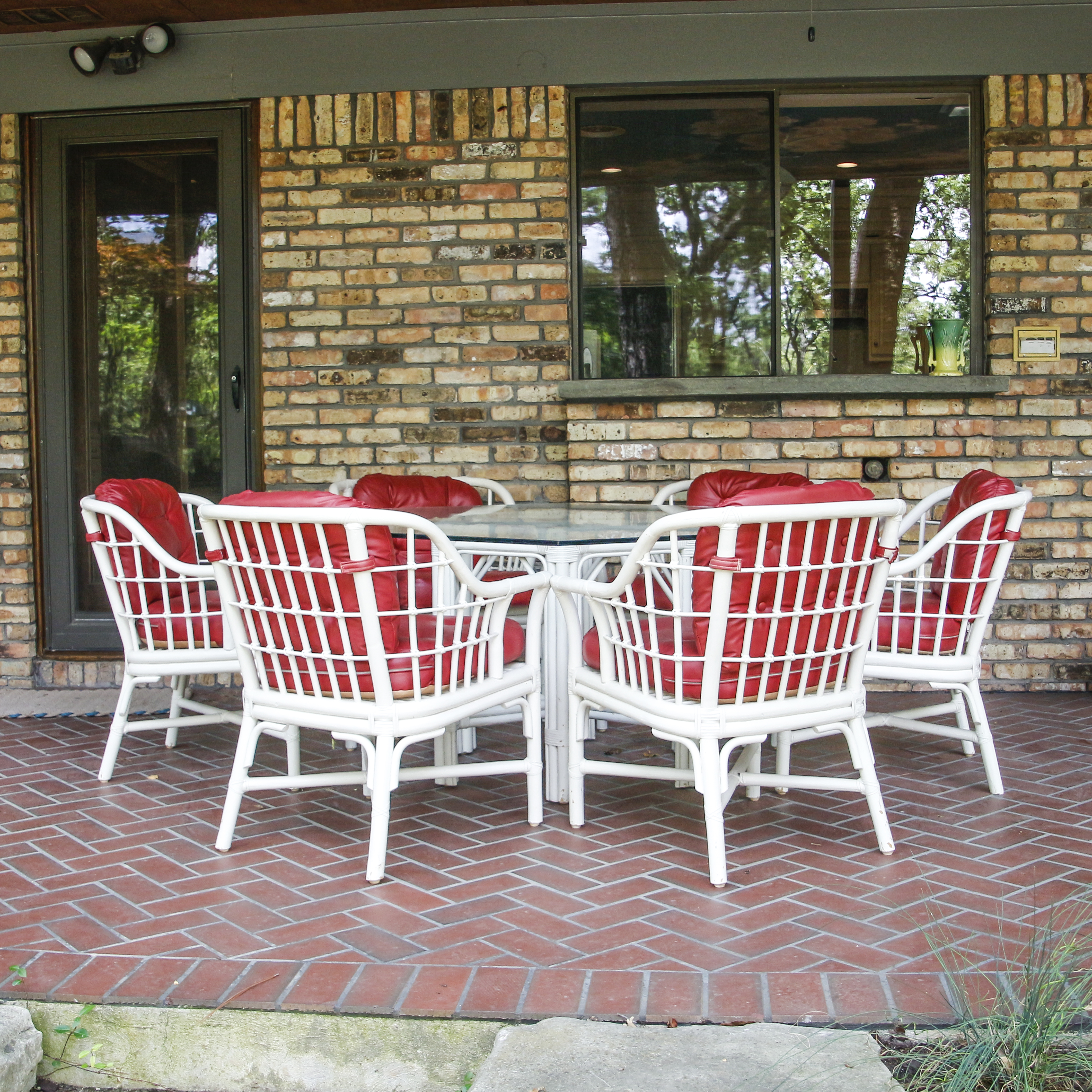 Glass Top Patio Table with White Painted Rattan Armchairs