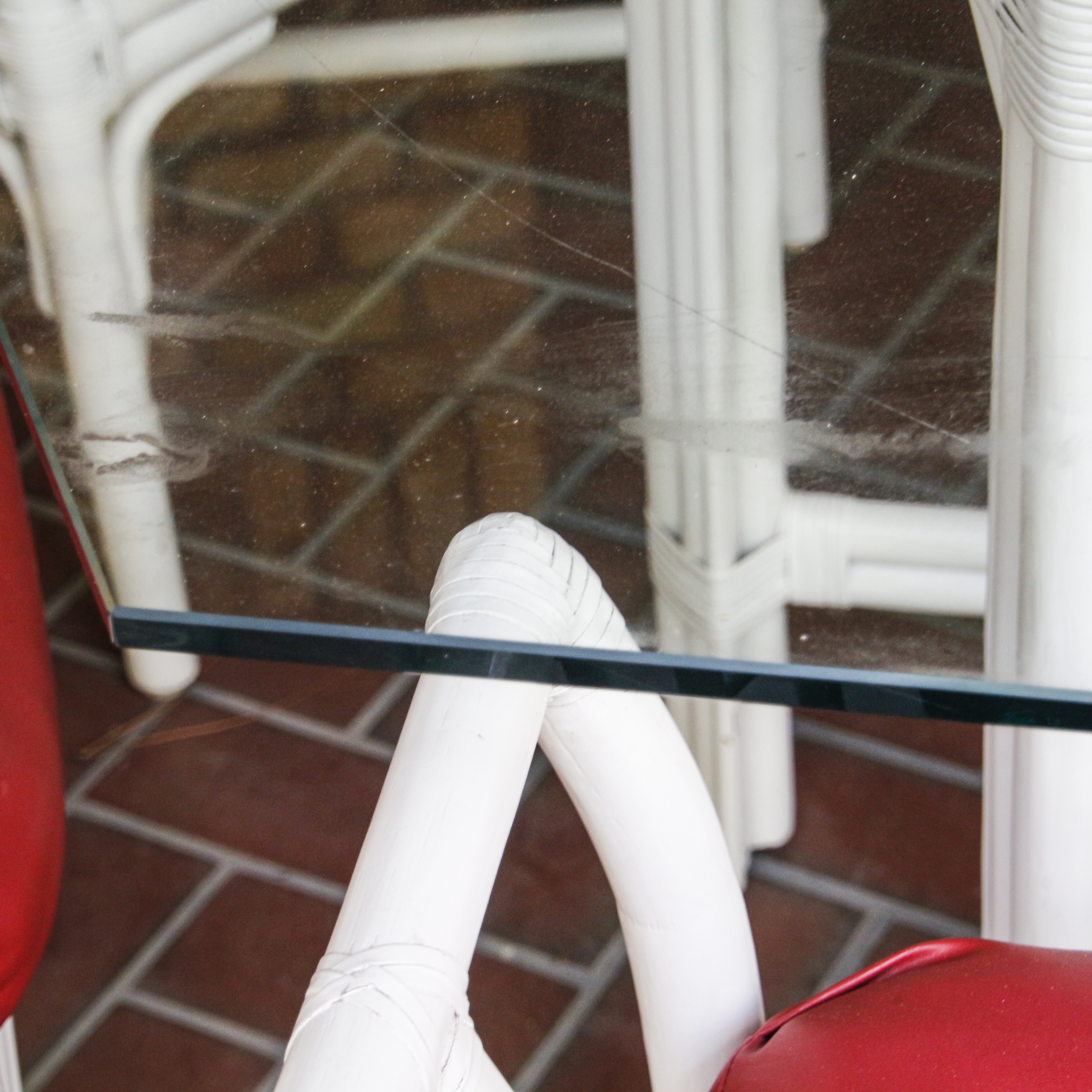 Glass Top Patio Table with White Painted Rattan Armchairs