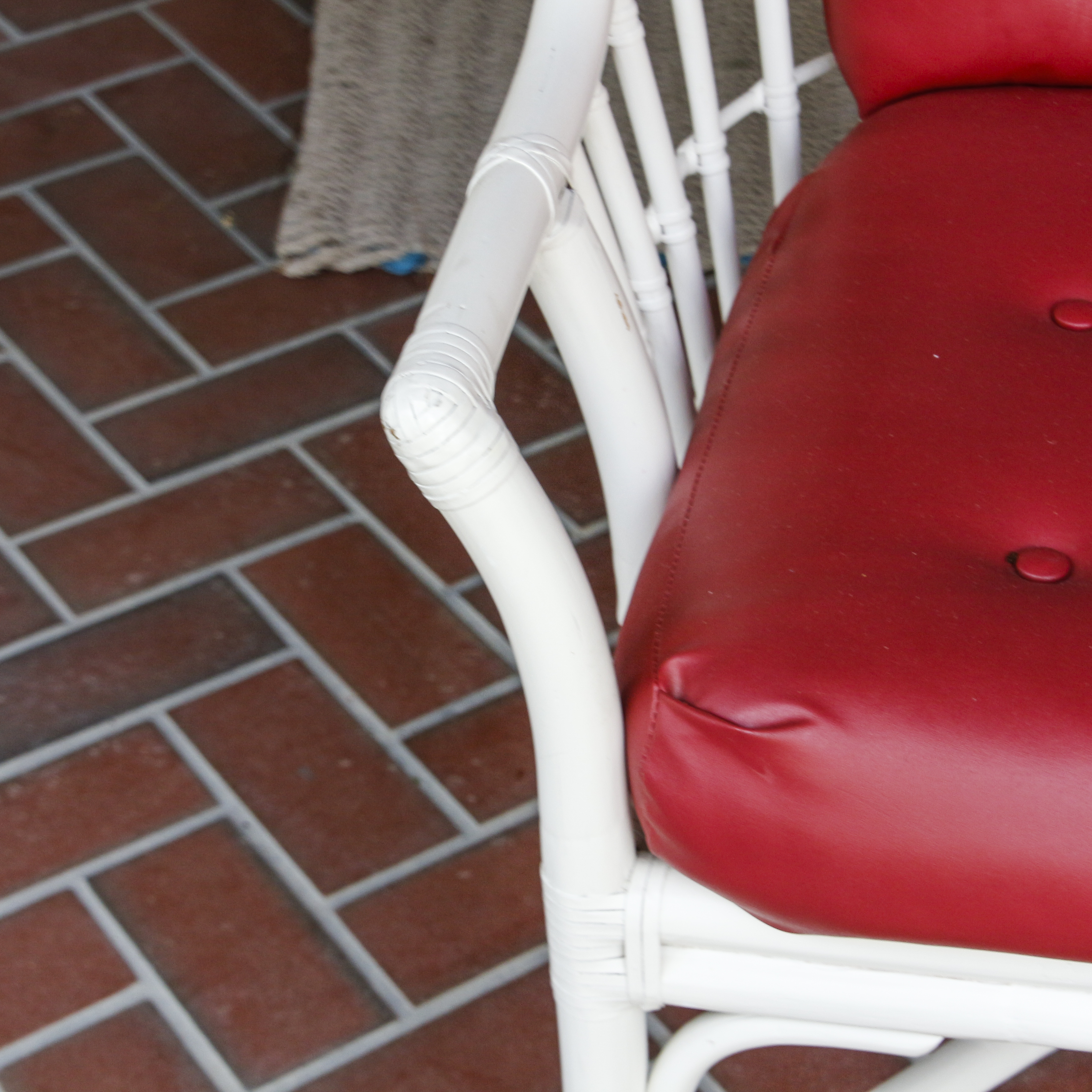 Glass Top Patio Table with White Painted Rattan Armchairs