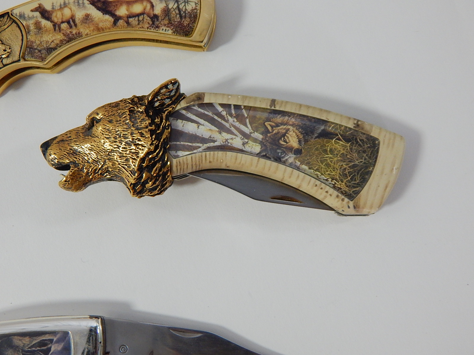 Franklin Mint Collectors Knives with Timber Wolf, Colt Revolver, Moose