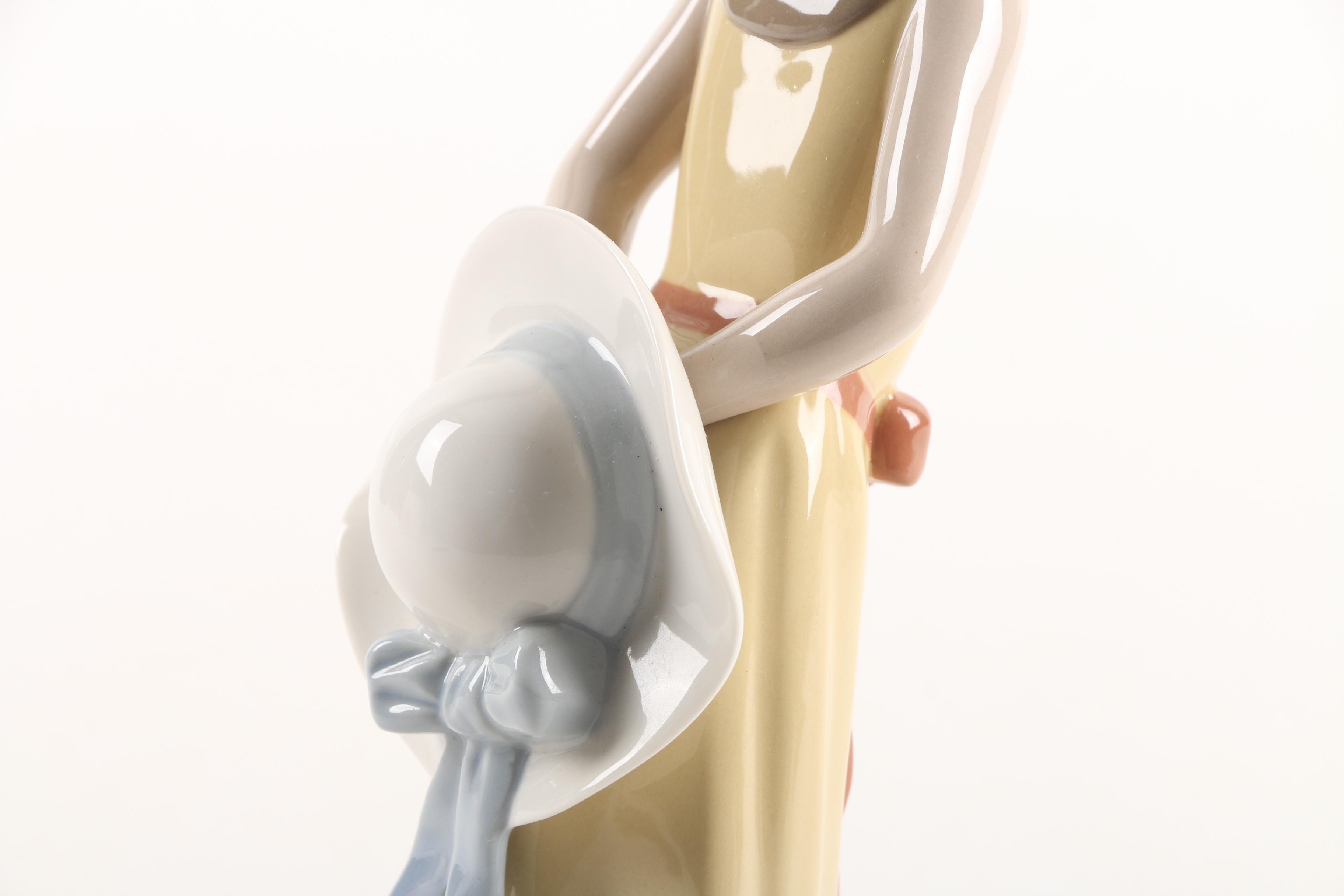 Lladró "Naughty Girl with Straw Hat" Porcelain Figurine