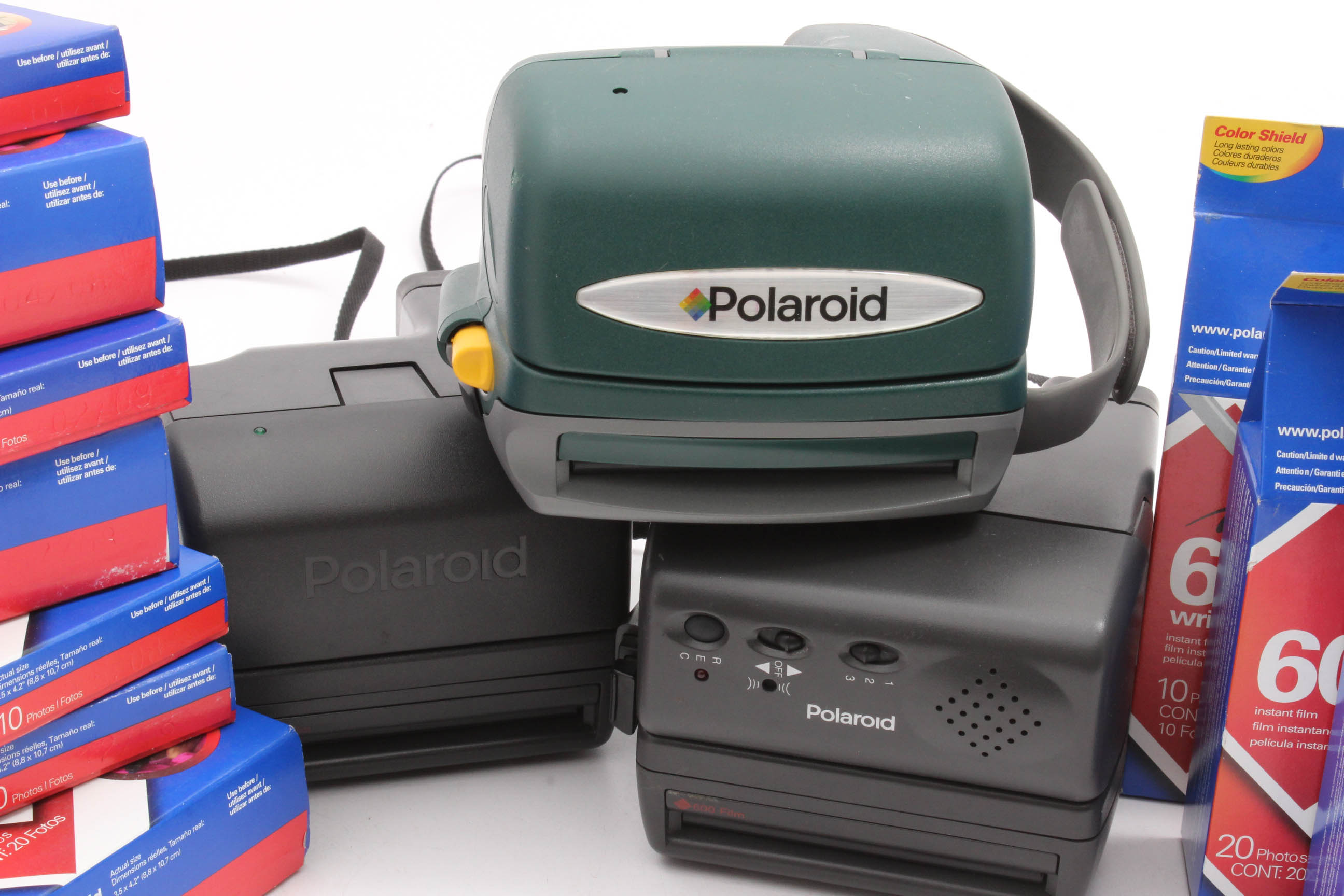 Three Polaroid Instant Film Cameras and Film