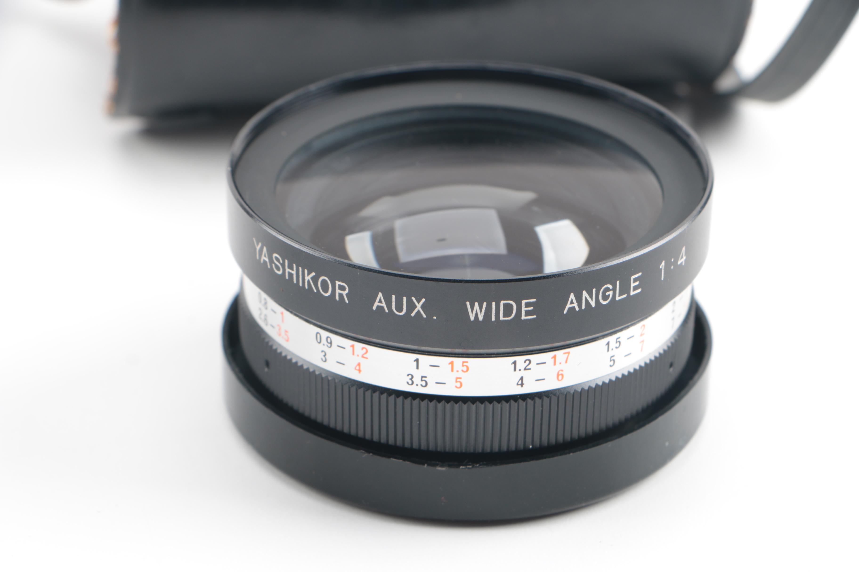 Vintage Yashica Electro 35 and FX-D Quartz Cameras with Cases and Accessories