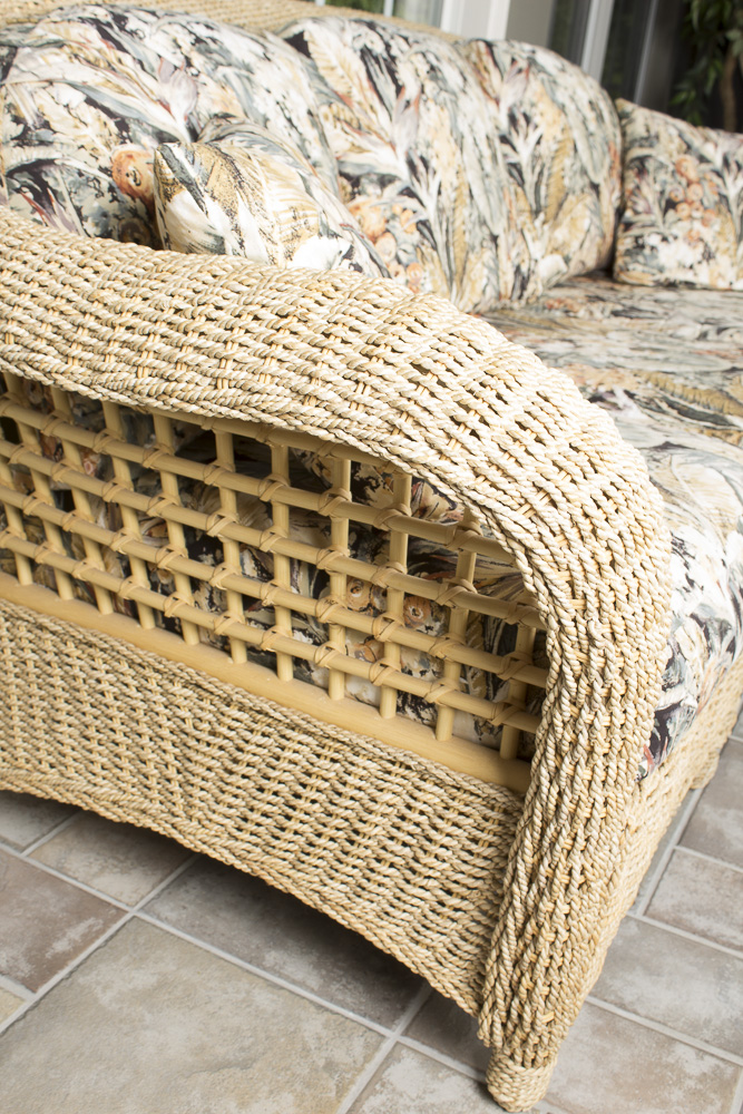 BenchCraft Wicker Patio Sofa with Floral Cushions