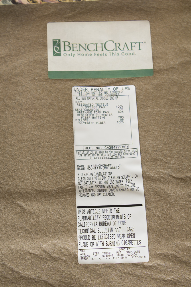 BenchCraft Wicker Patio Sofa with Floral Cushions