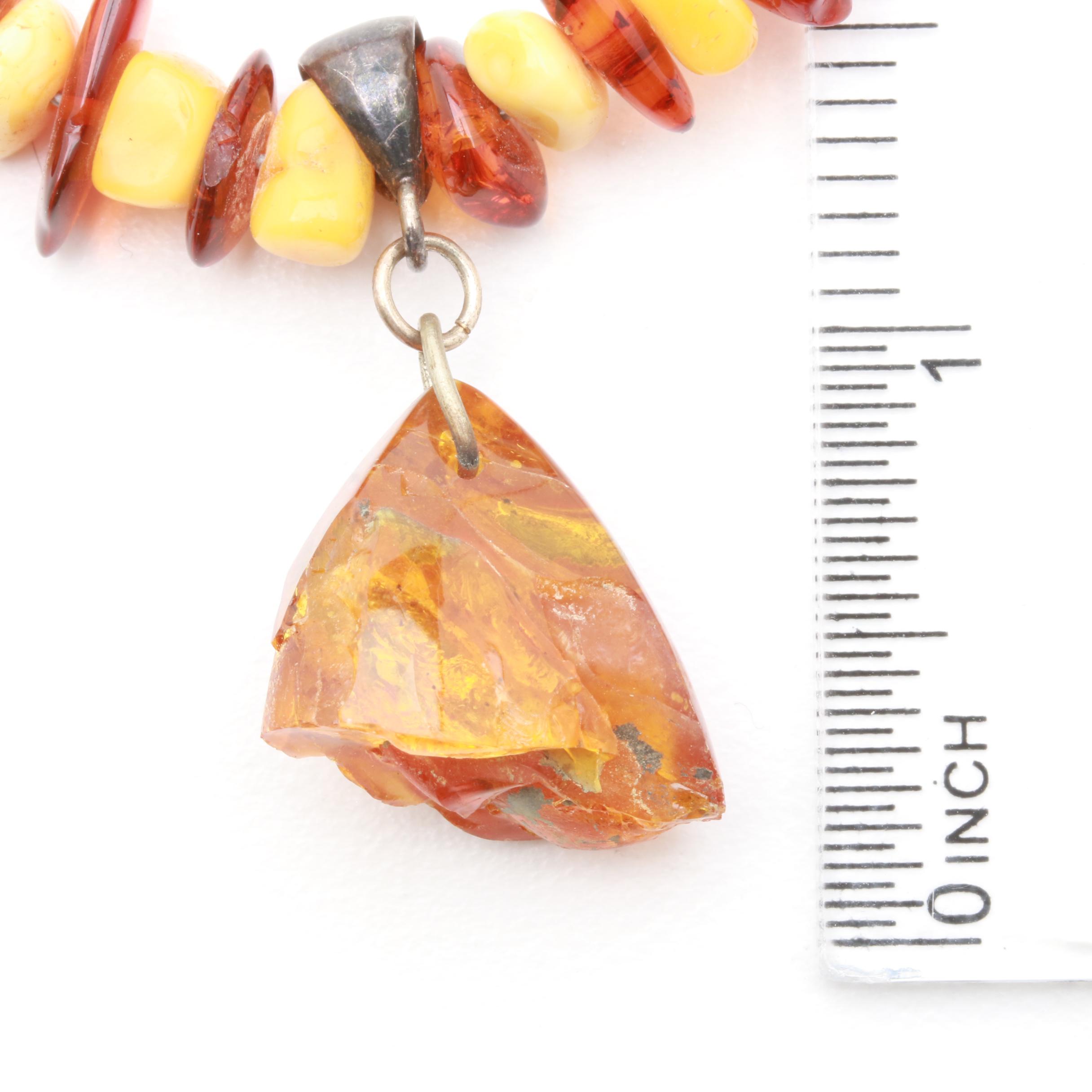 Assortment of Gemstone Necklaces Including Sterling Silver and Amber