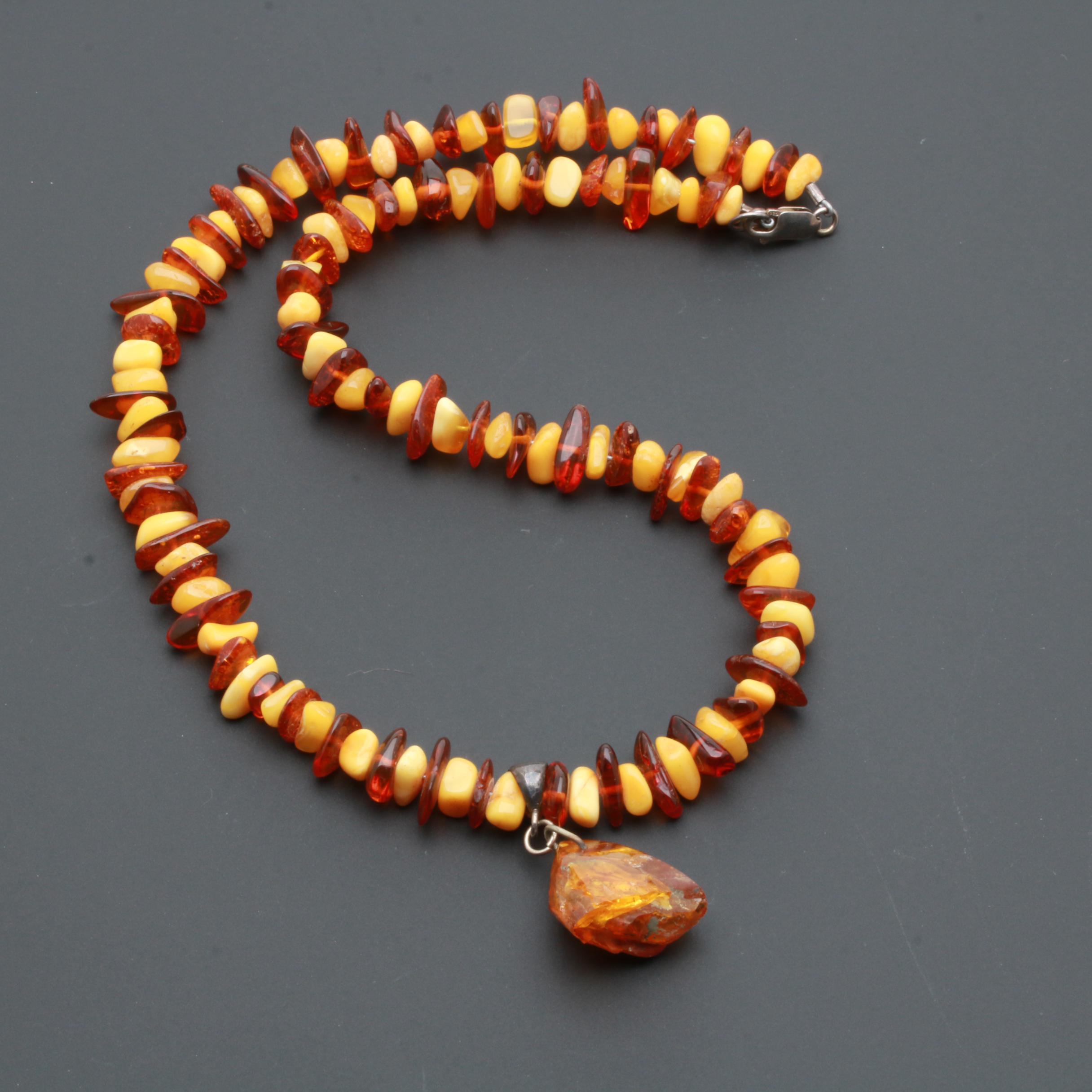 Assortment of Gemstone Necklaces Including Sterling Silver and Amber