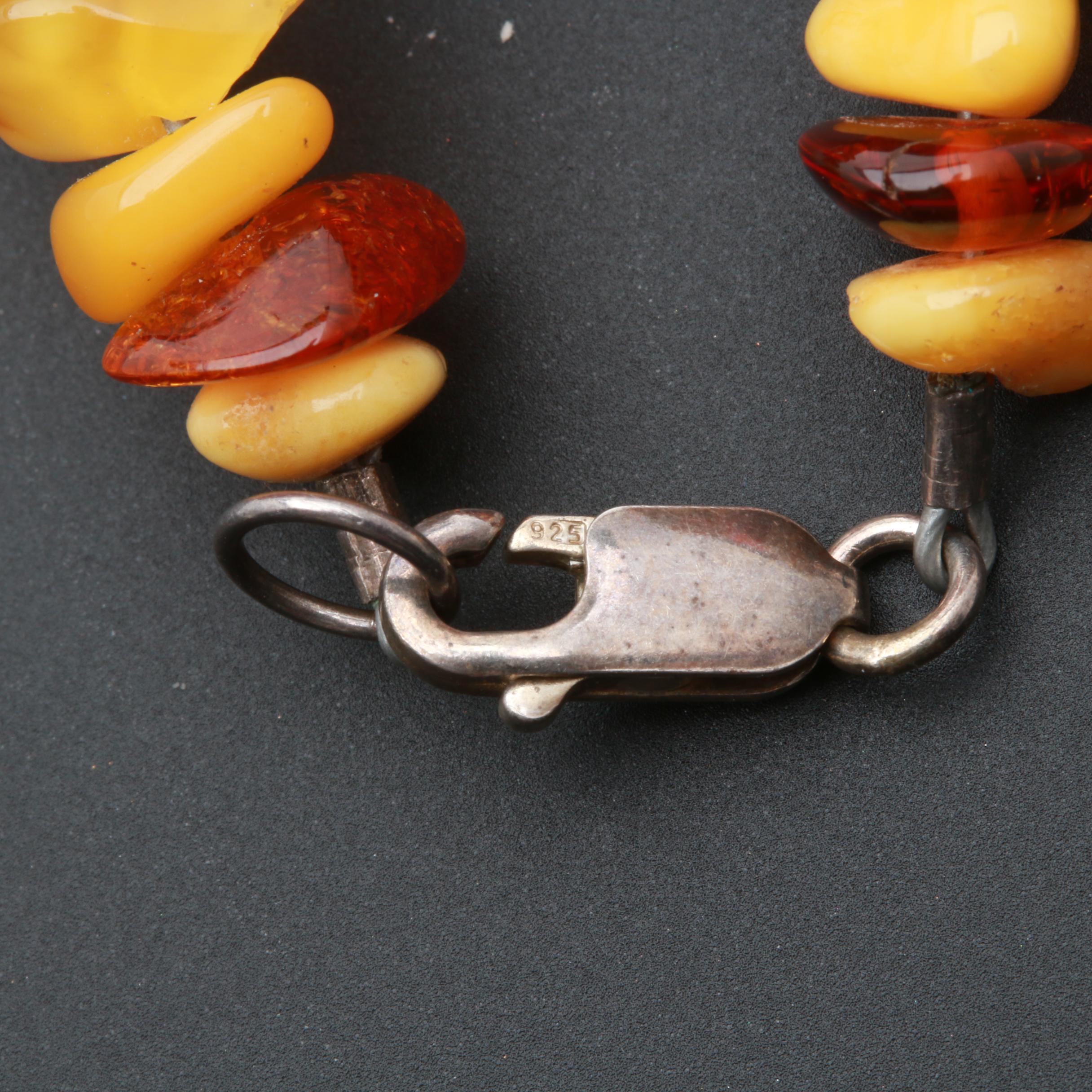 Assortment of Gemstone Necklaces Including Sterling Silver and Amber