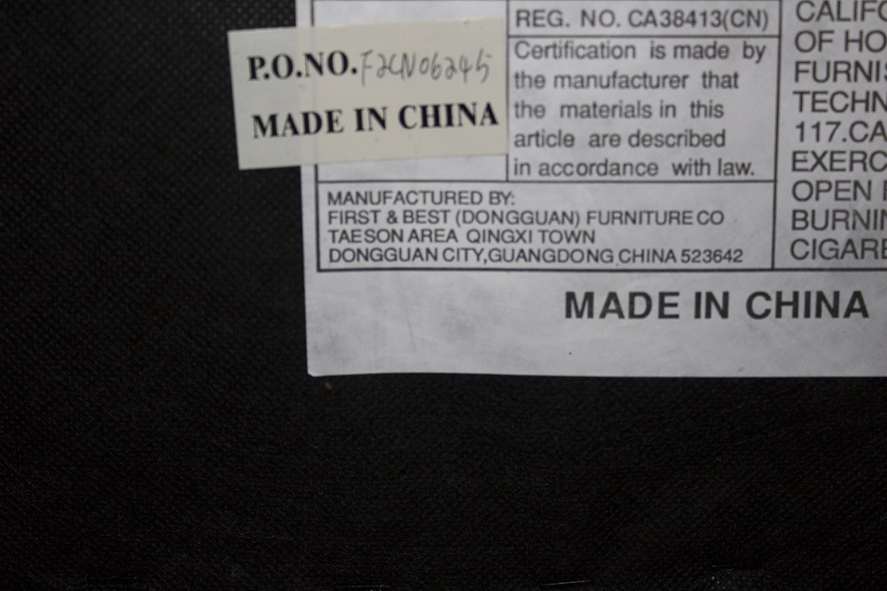 Black Faux Leather Recliner by First & Best Furniture Company