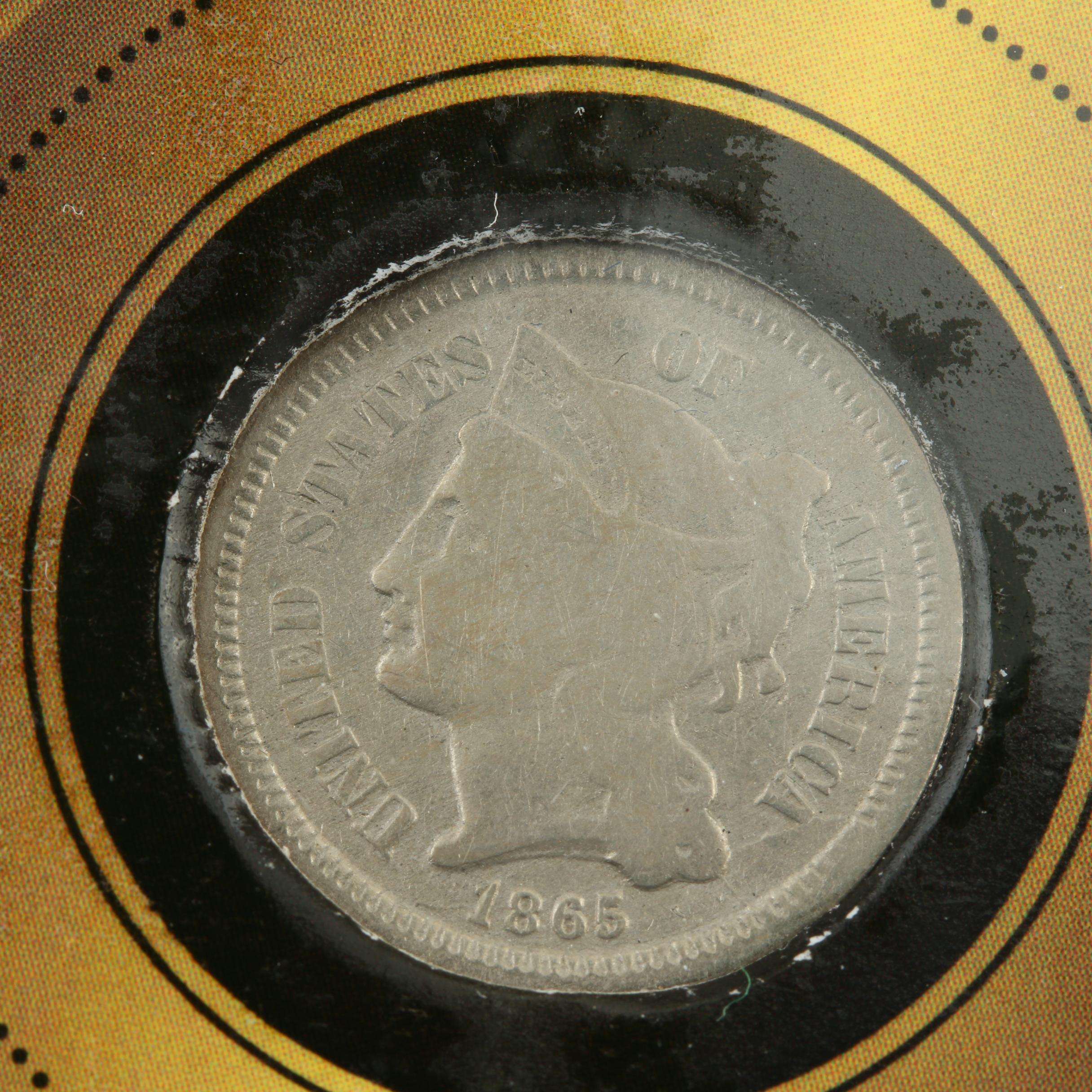 "Native American Arrowhead and Coin Collection" and a 3-Cent Nickel Coin