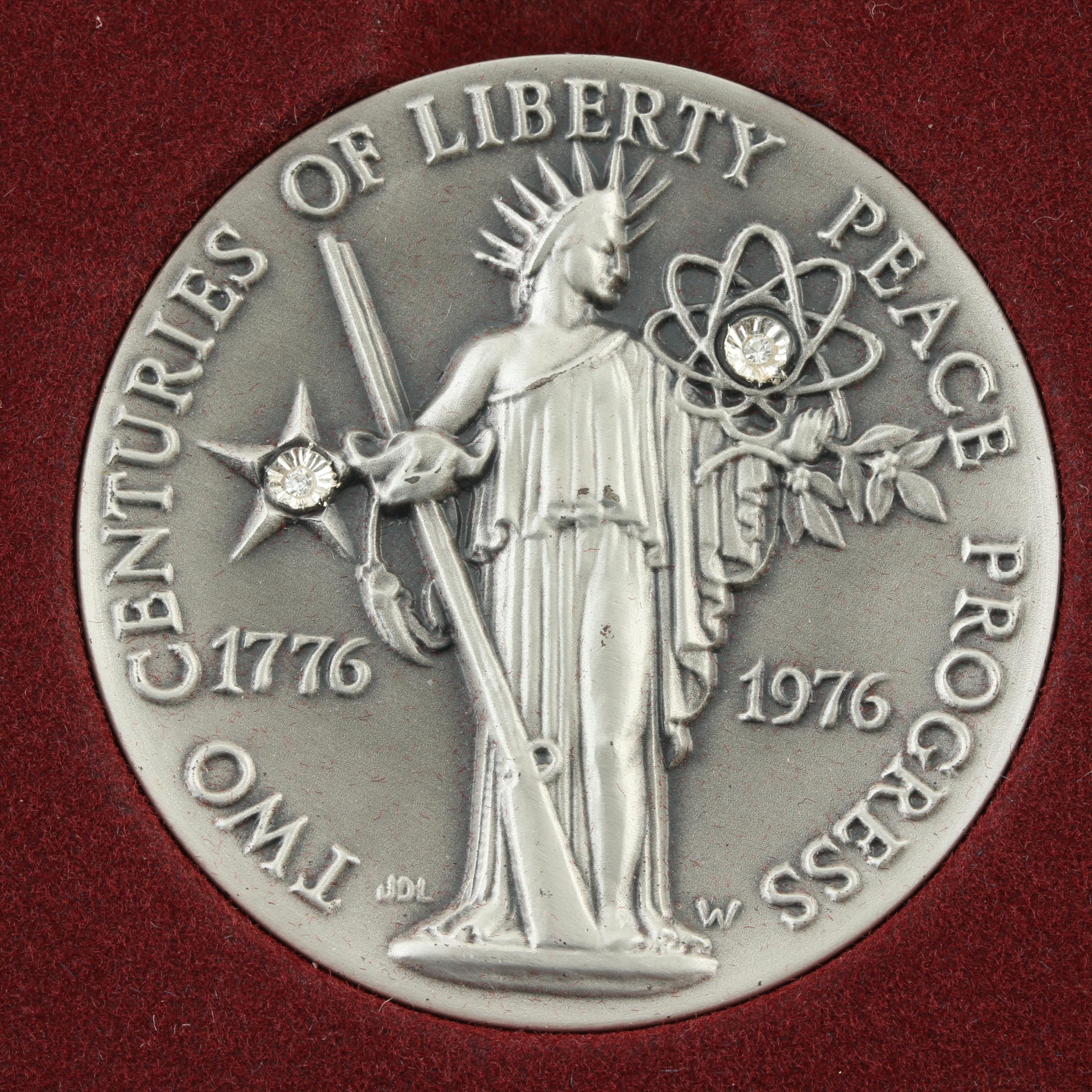 Commemorative Canadian Proof Silver Dollar and a Statue of Liberty Silver Medal