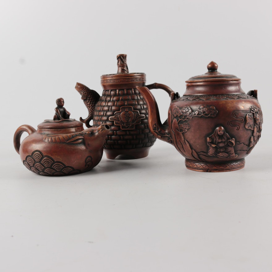 Chinese Bronze Finished Metal Teapots with Embossed Figurative Ornamentation