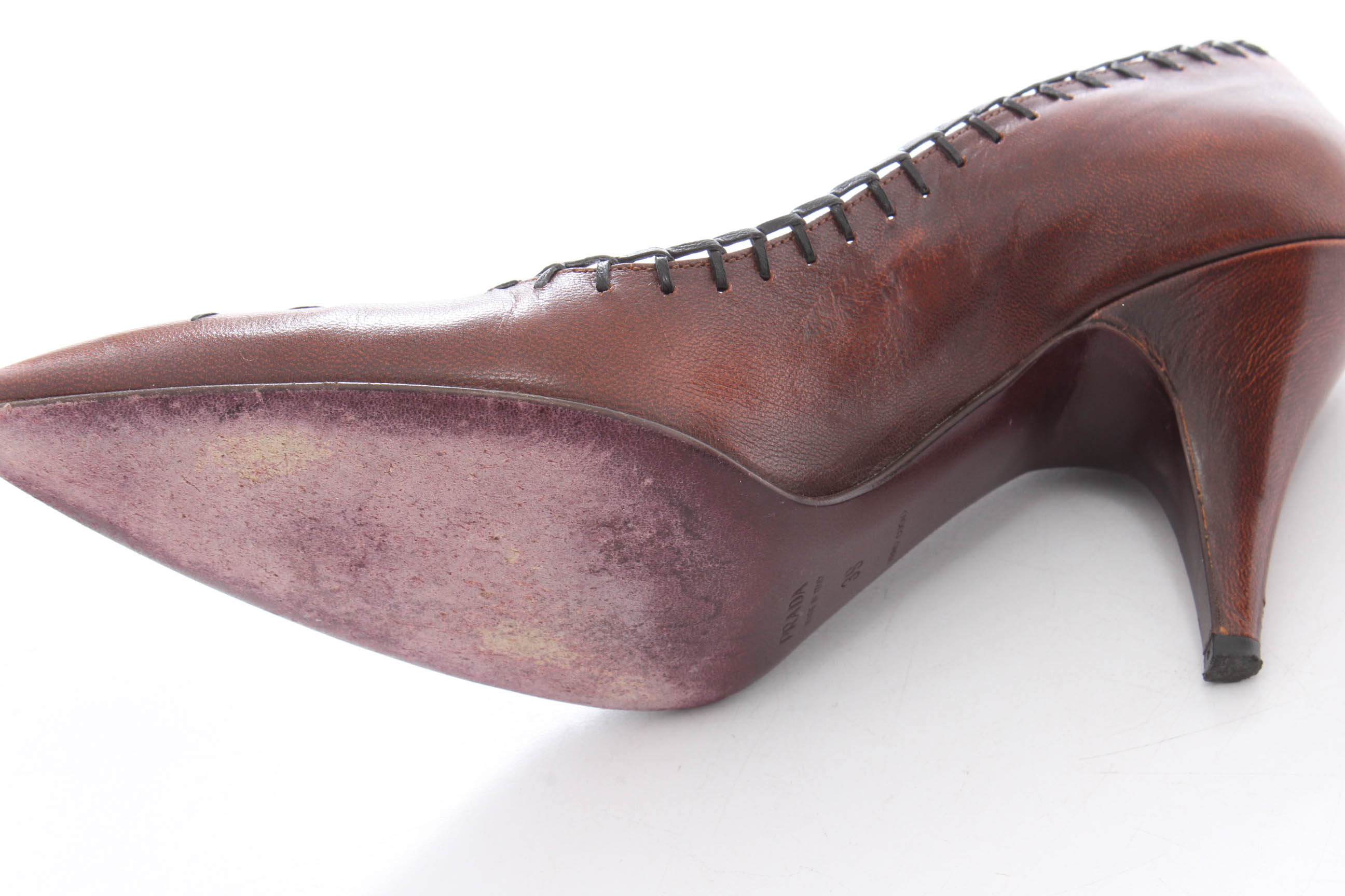 Prada Whip Stitched Leather Floral Pumps