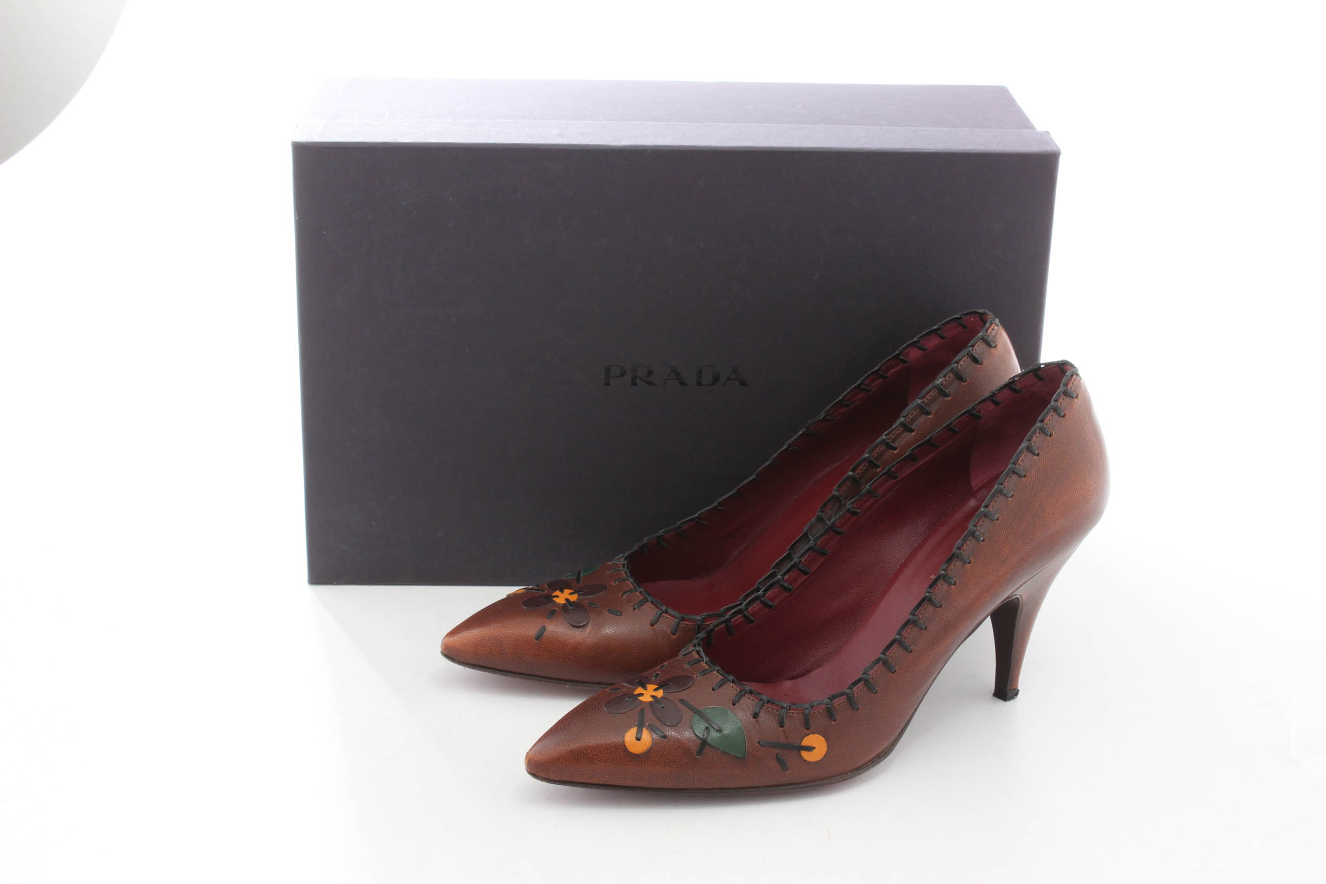 Prada Whip Stitched Leather Floral Pumps