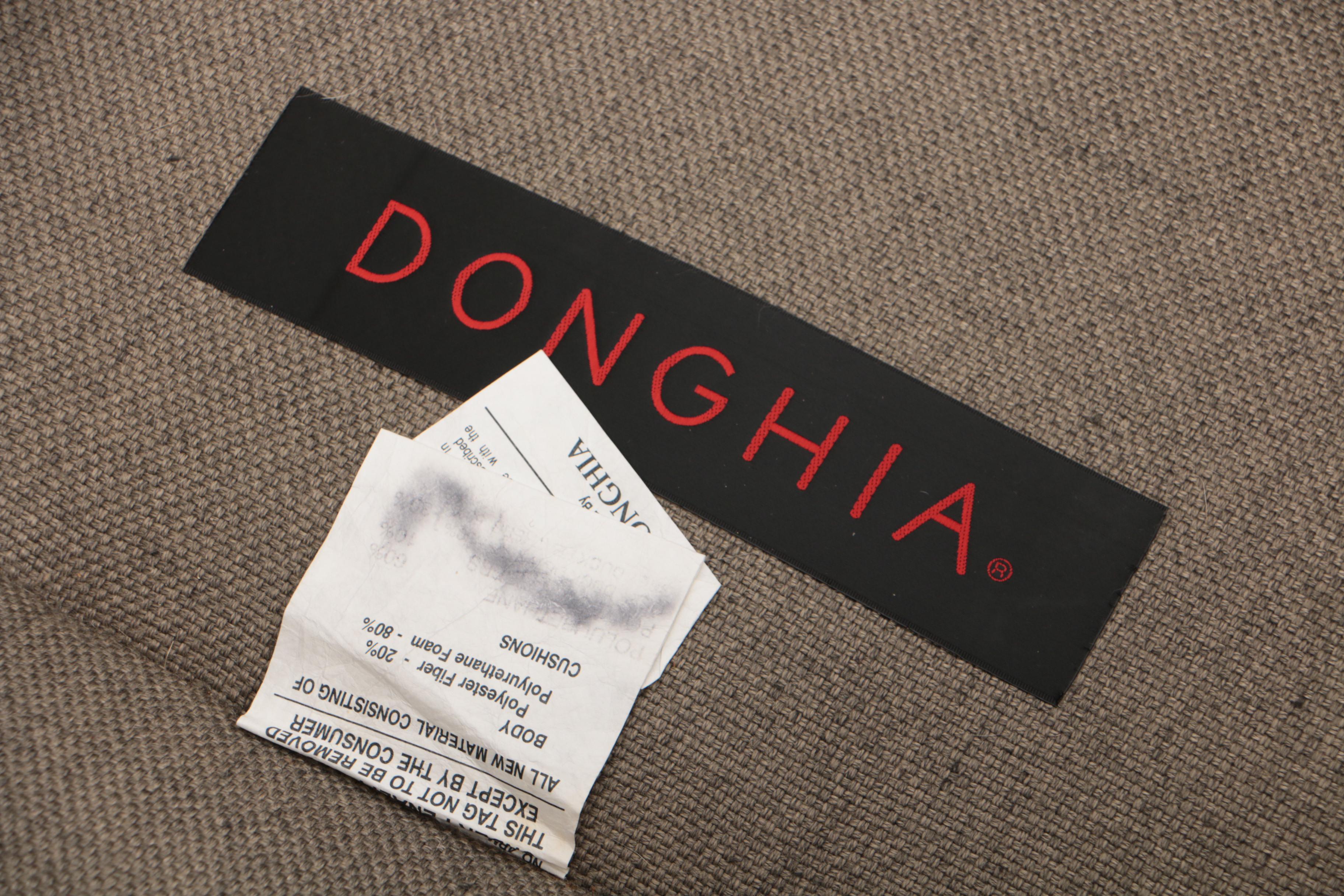 Pair of Donghia "Noble" Swivel Chairs and Ottoman