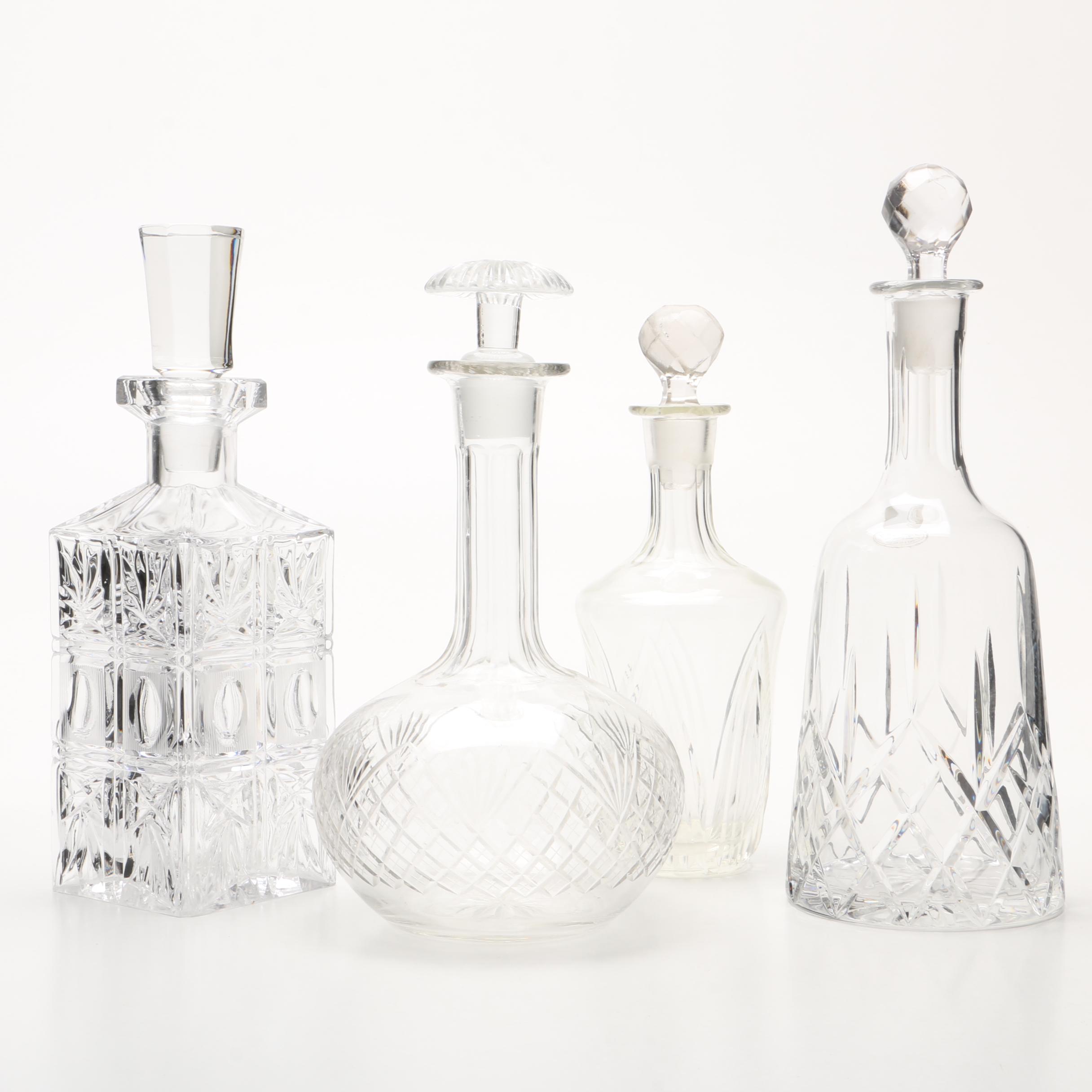 Four Cut and Molded Glass Decanters and Stoppers, 20th Century