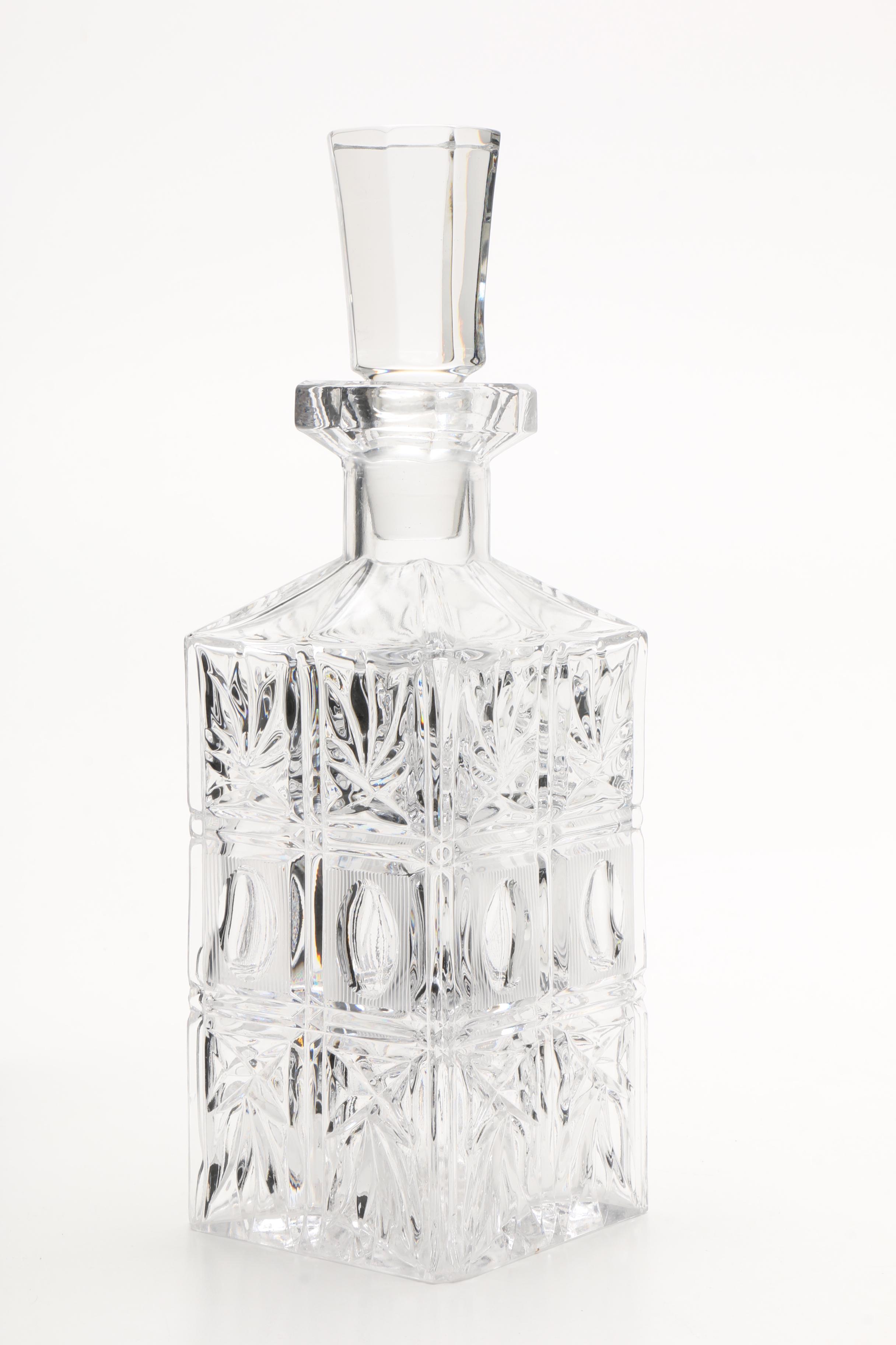 Four Cut and Molded Glass Decanters and Stoppers, 20th Century