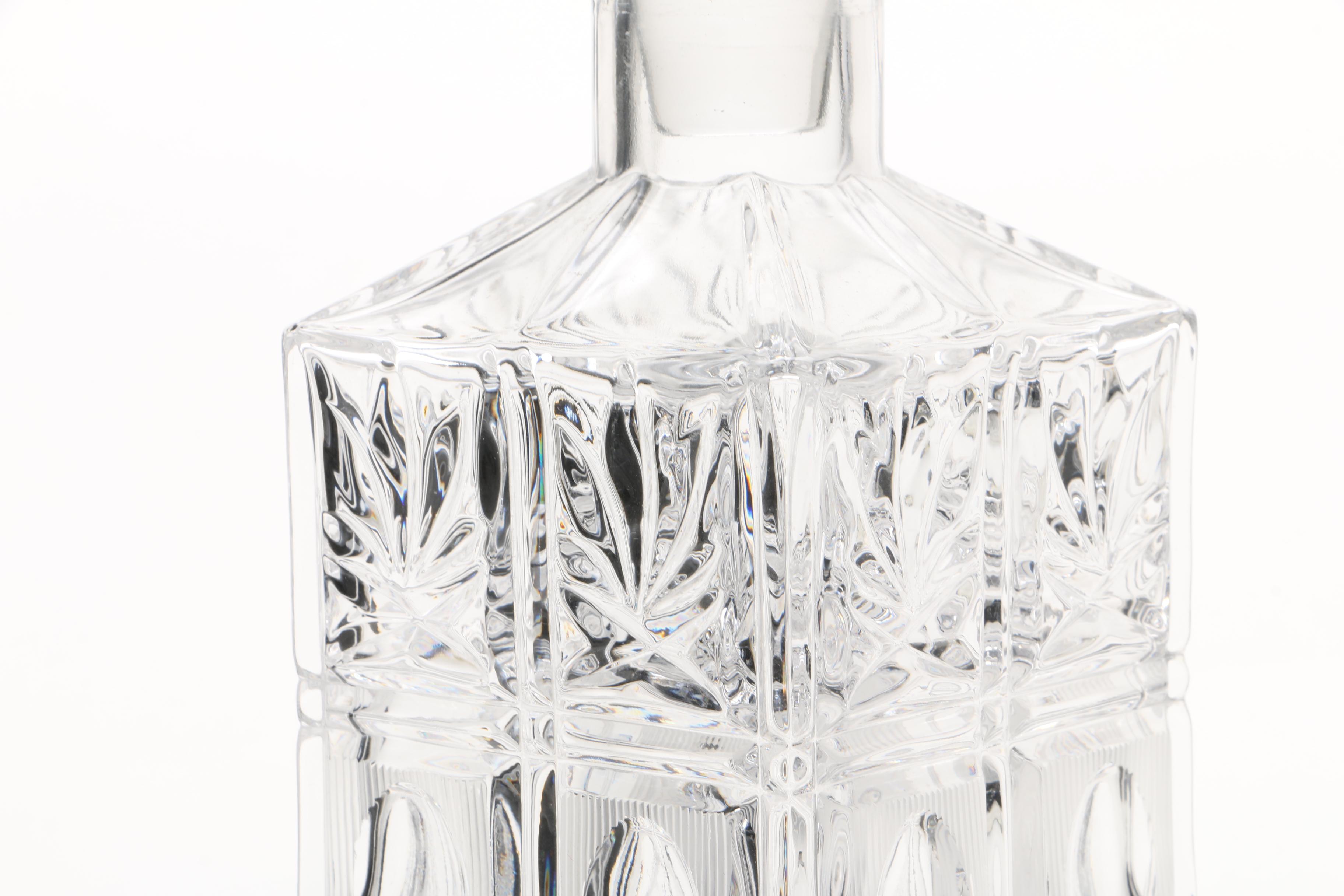 Four Cut and Molded Glass Decanters and Stoppers, 20th Century