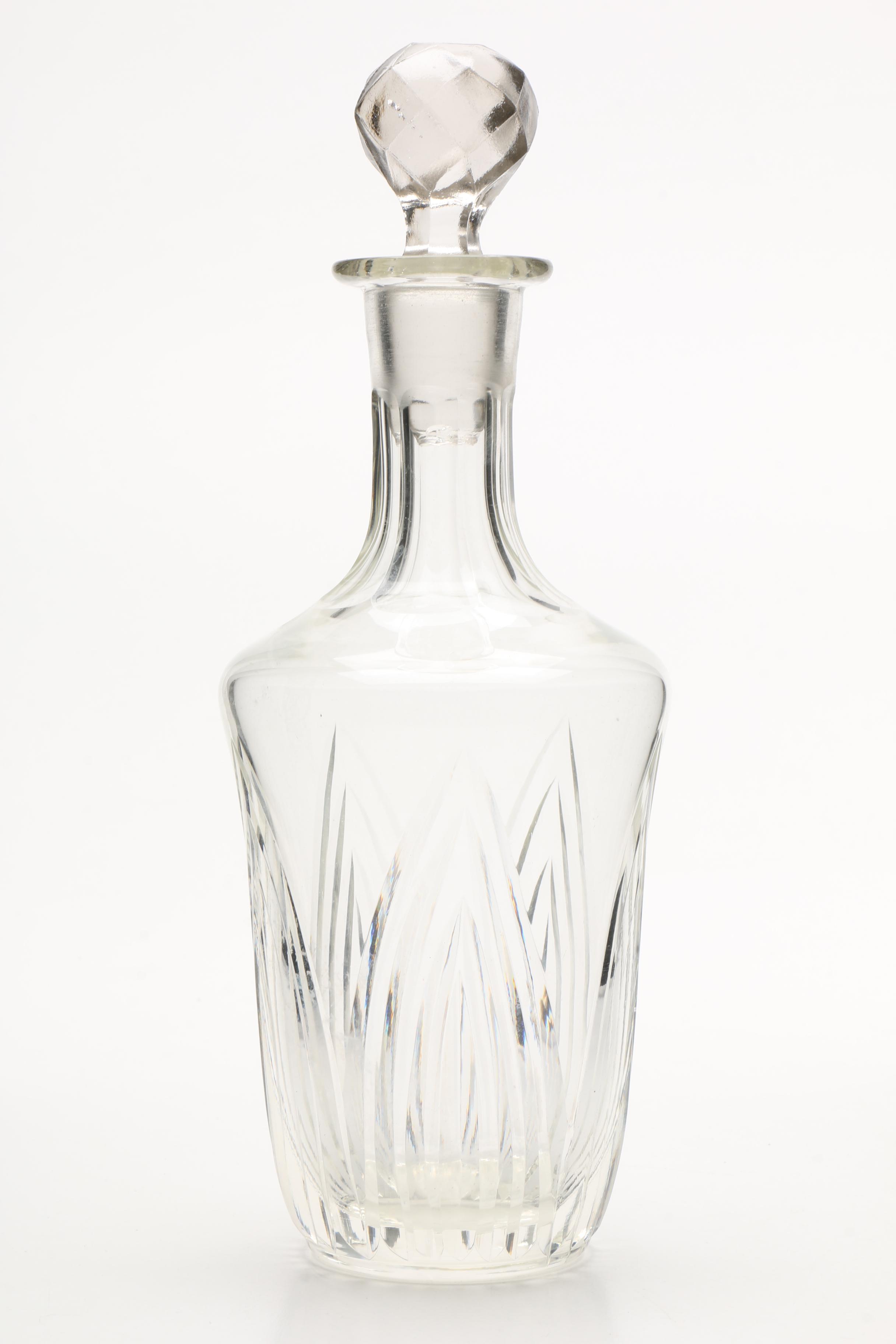 Four Cut and Molded Glass Decanters and Stoppers, 20th Century