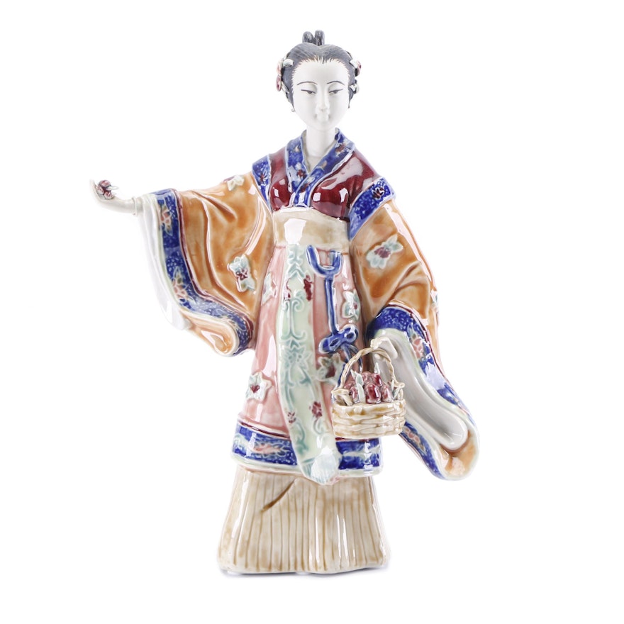 Chinese Shiwan Style Porcelain Figurine of Woman Holding Flowers