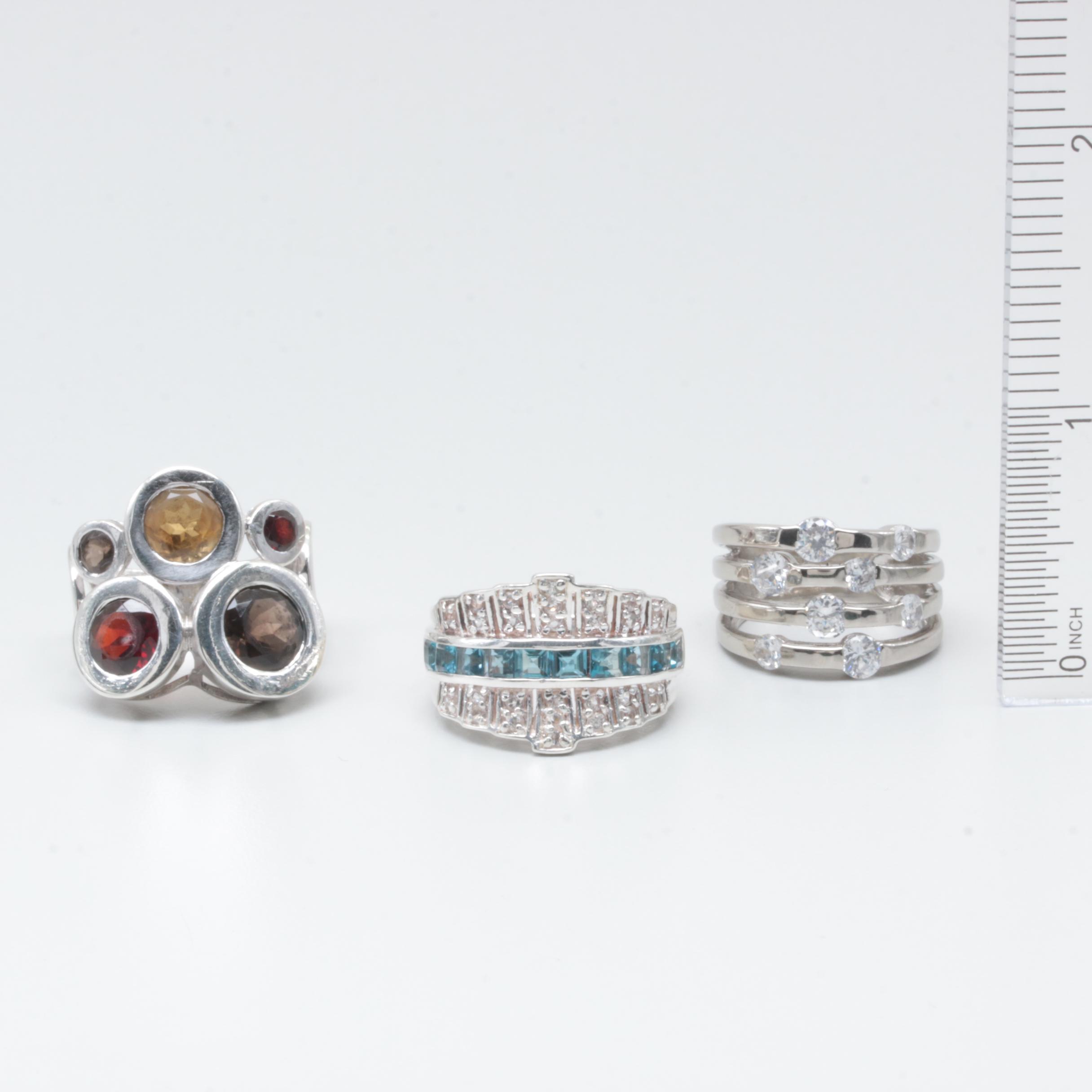 Sterling Silver Rings Including Garnet, Citrine, and Blue Topaz